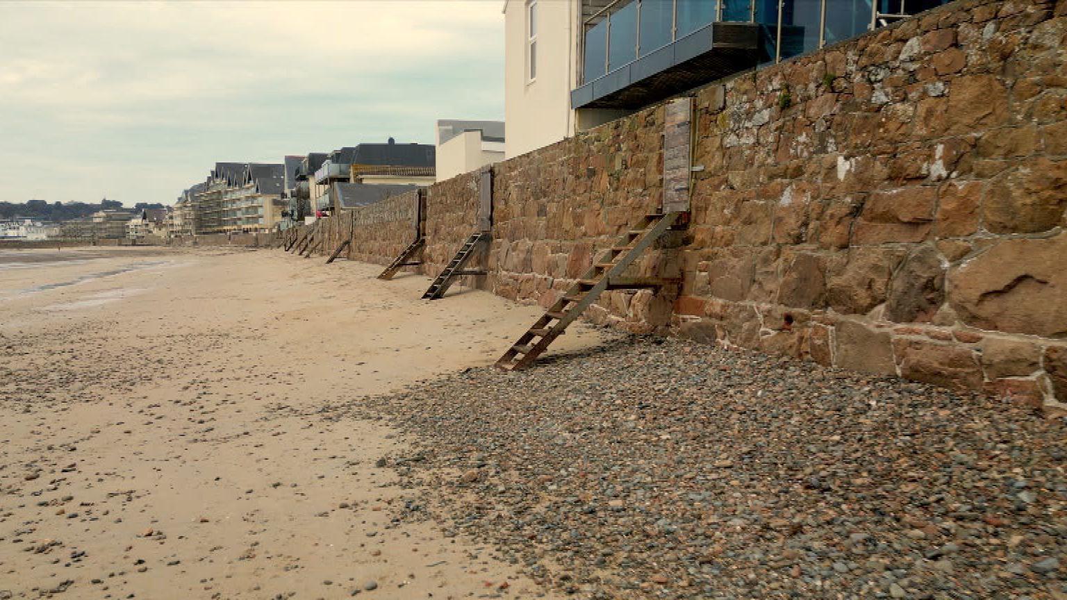 Ladders leading from homes onto the beach at the foreshore