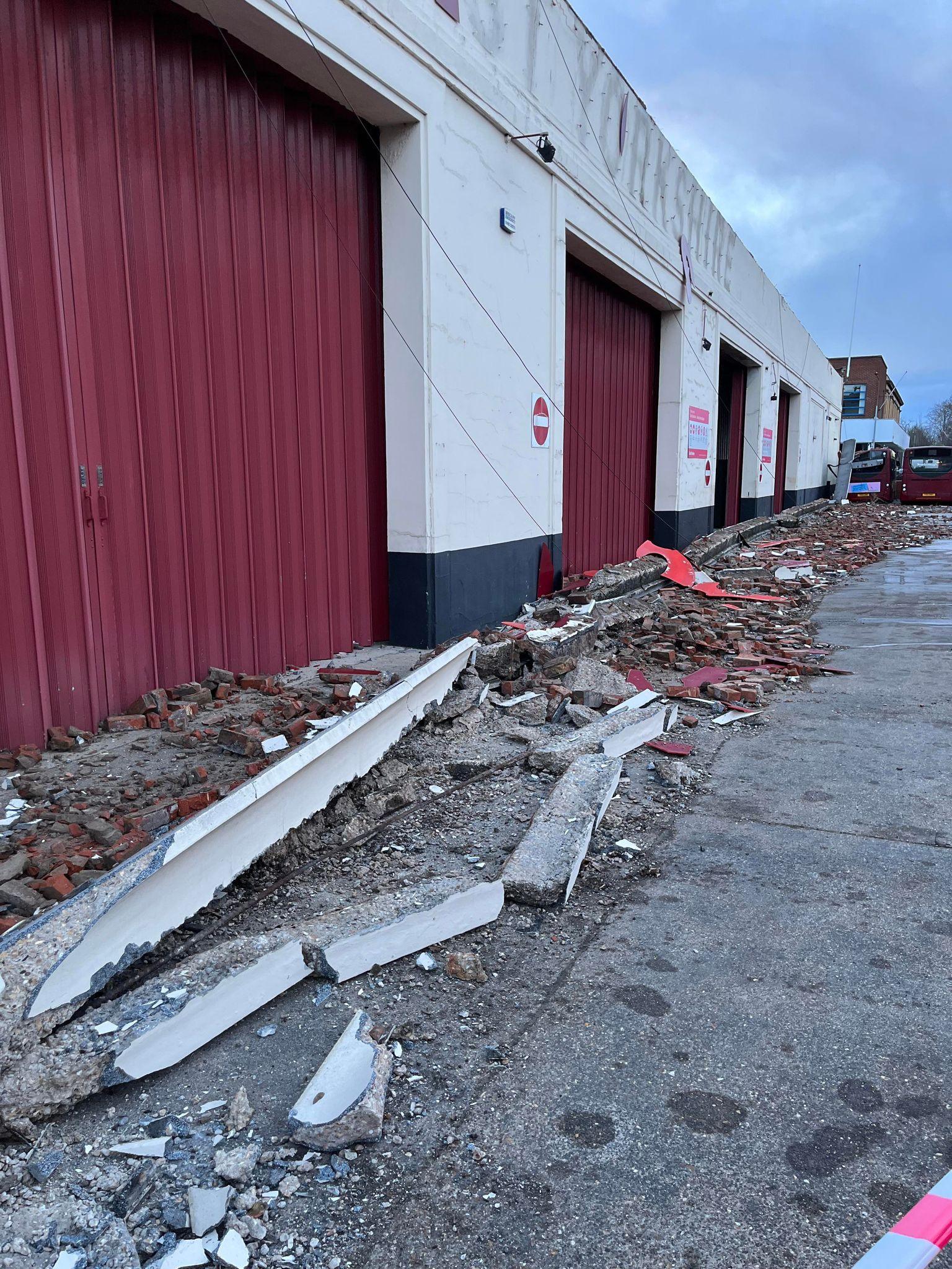 Rubble lined along a bus depot