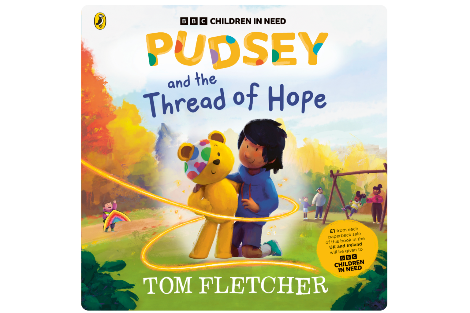 Front cover of Pudsey and the Thread of Hope, with a cartoon image of Pudsey and a young boy shown with their arms around each other. In the background are trees and children playing on swings. 