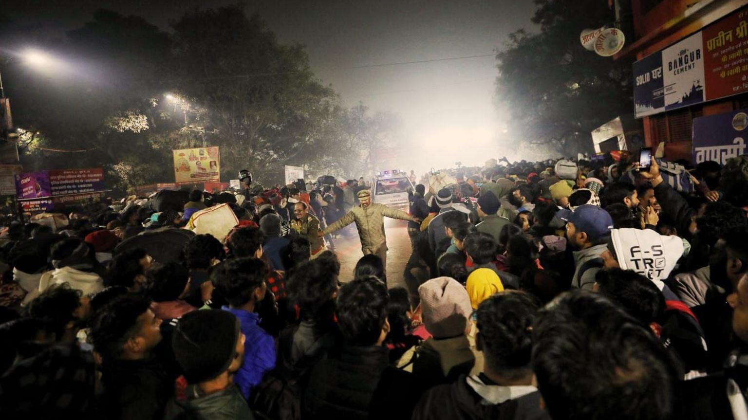 A policeman clearing the road as an ambulance passes by after a deadly stampede before the second "Shahi Snan" (grand bath), at the "Kumbh Mela" or the Pitcher Festival, in Prayagraj, previously known as Allahabad, India, January 29, 2025.