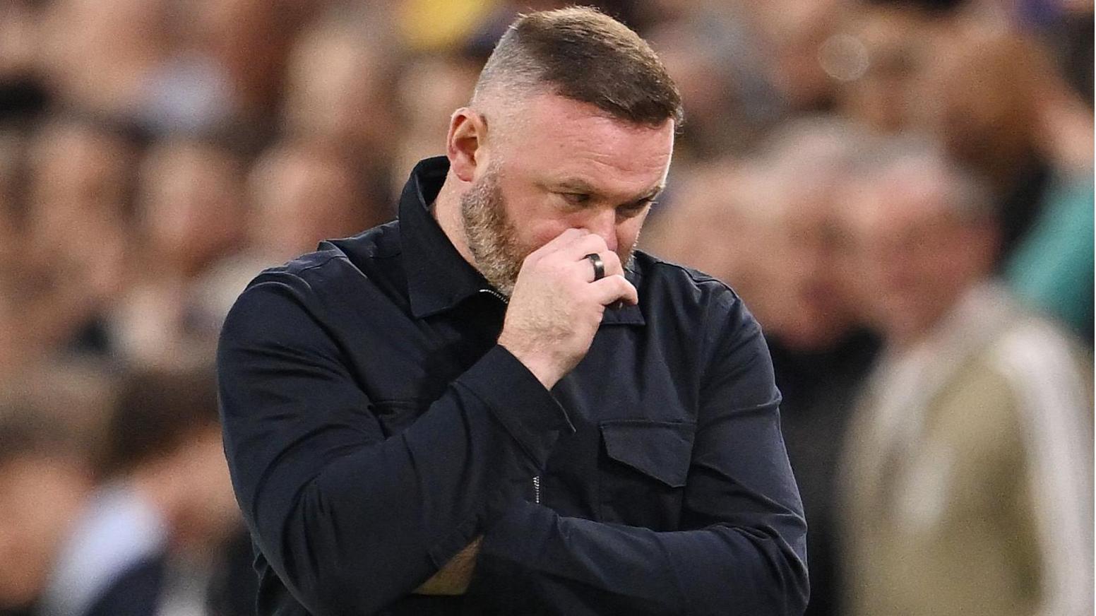 Wayne Rooney looks sad during defeat to Leeds