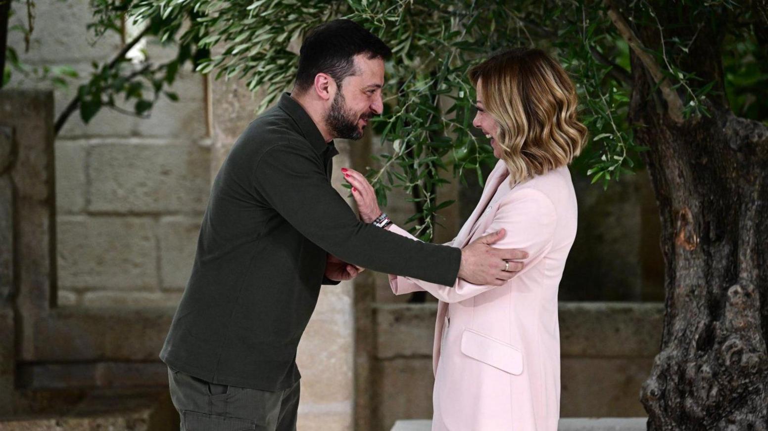 Italian Prime Minister Giorgia Meloni (right) greets Ukrainian President Volodymyr Zelensky at the G7 in Puglia, southern Italy. Photo: 13 June 2024