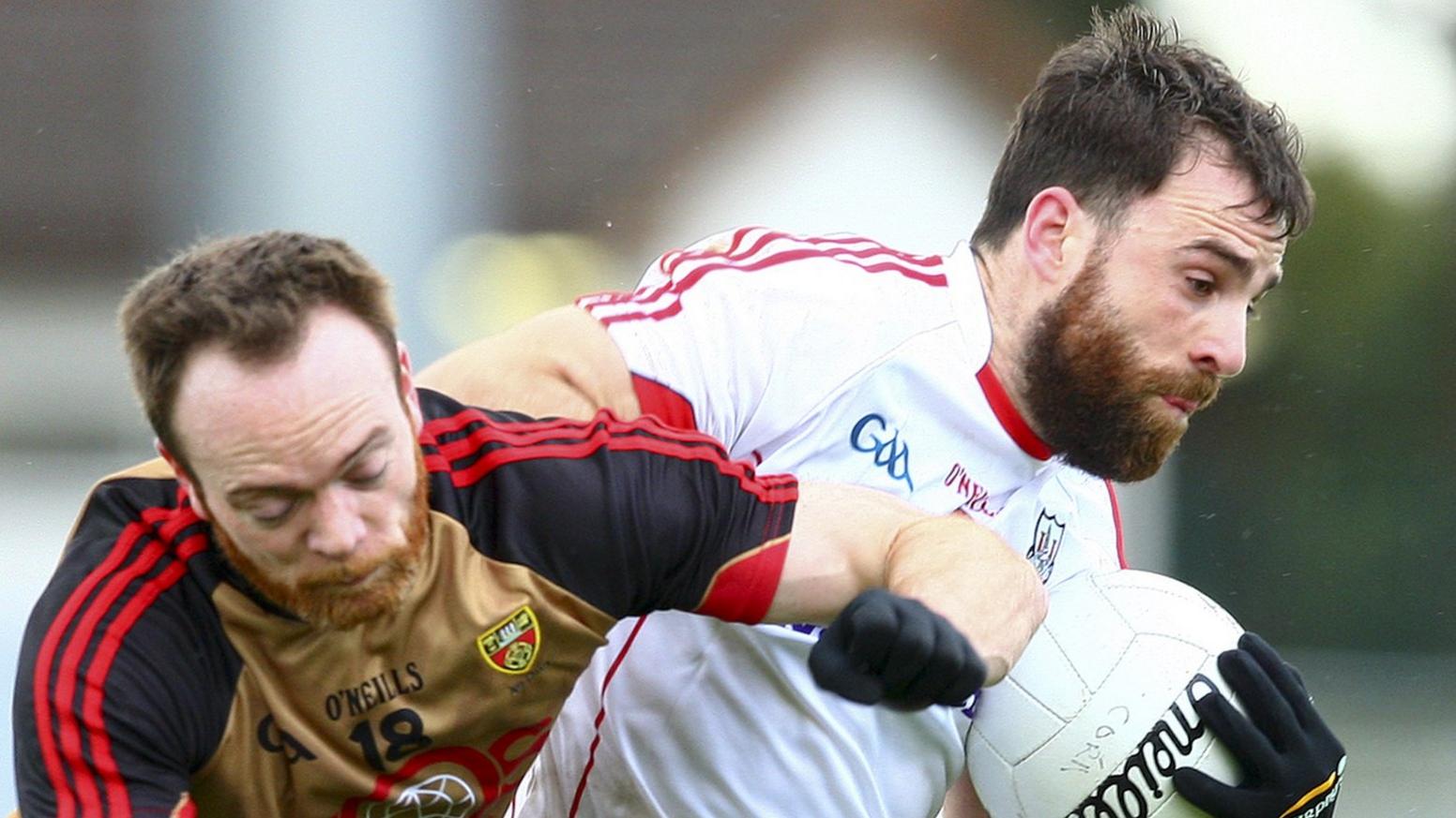 Down's Ryan Mallon battles with Cork's Colm O'Driscoll at Pairc Ui Rinn