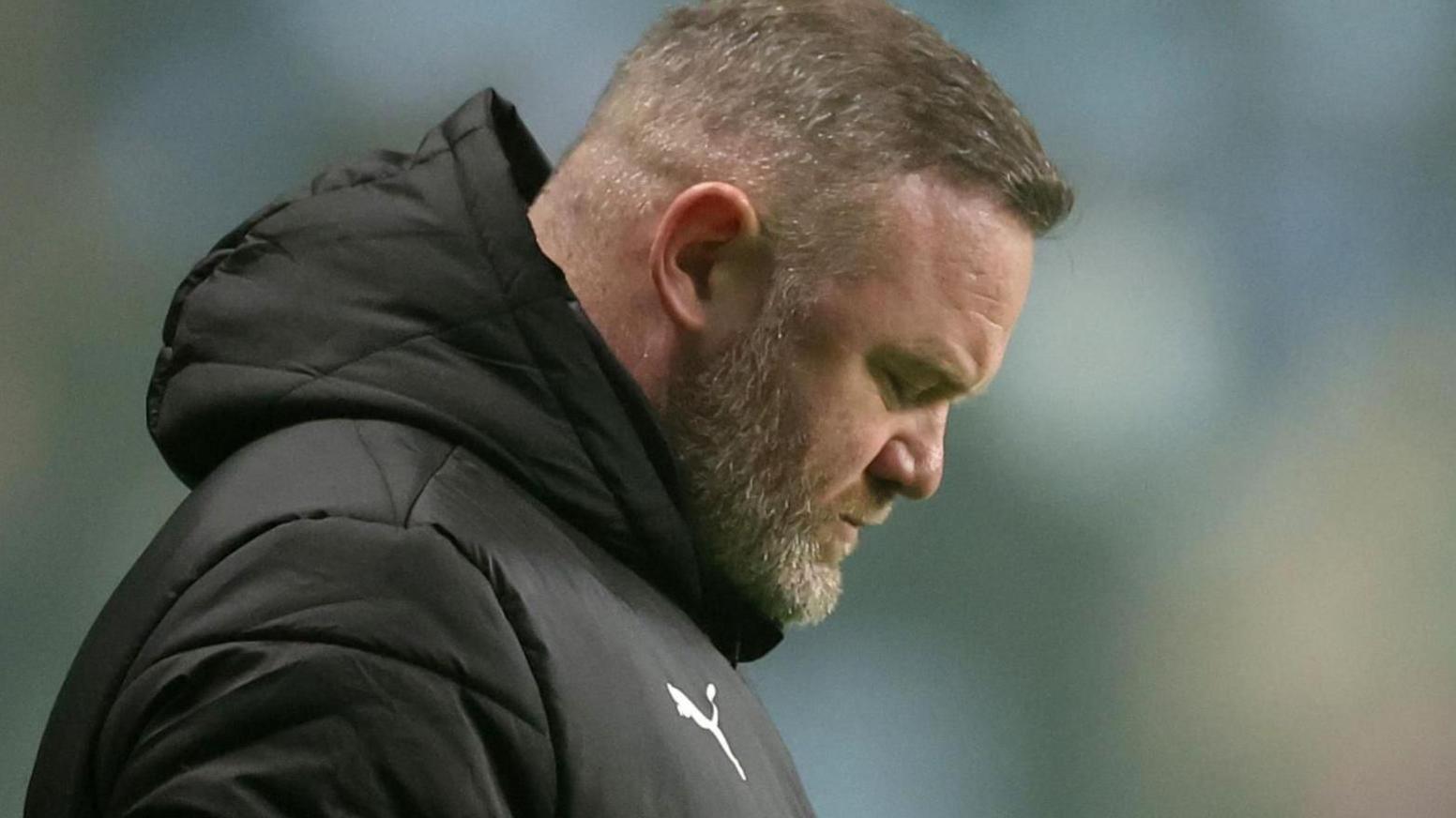 A downcast Wayne Rooney during his time in charge of Plymouth