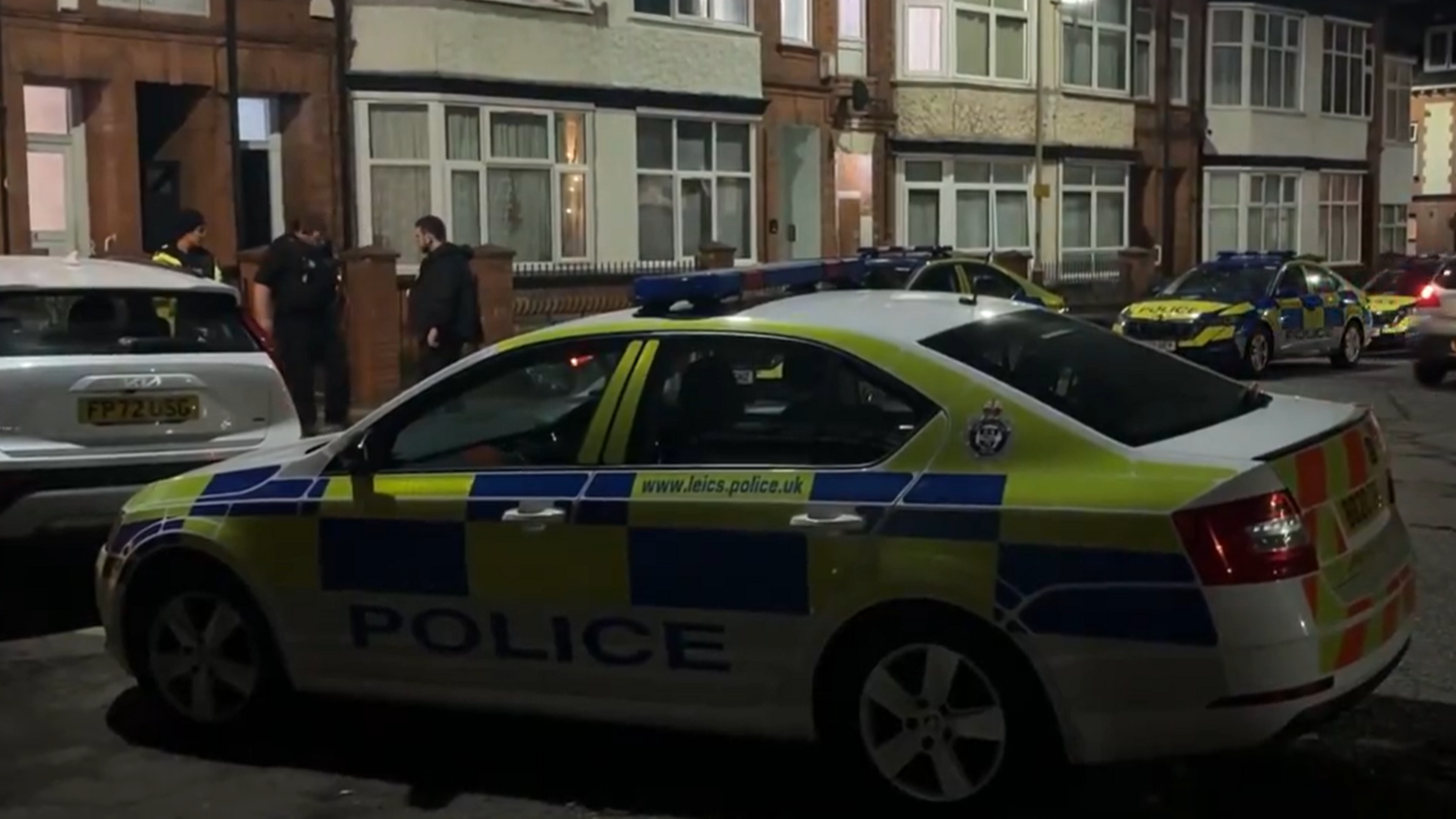 Four police cars parked outside of a house in Kimberley Road, Leicester