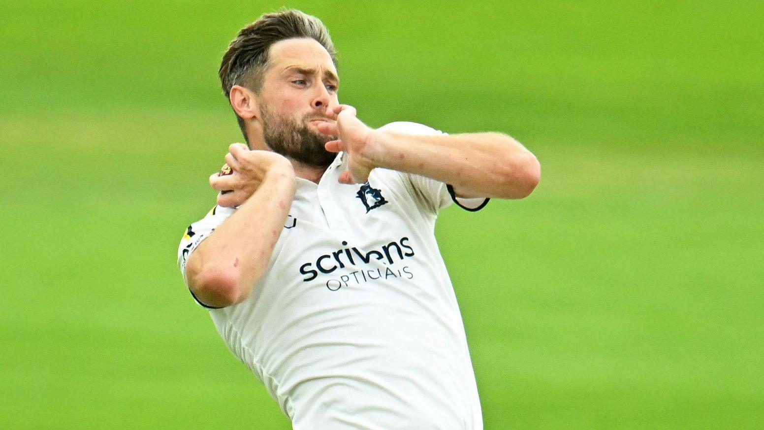 Chris Woakes bowling for Warwickshire