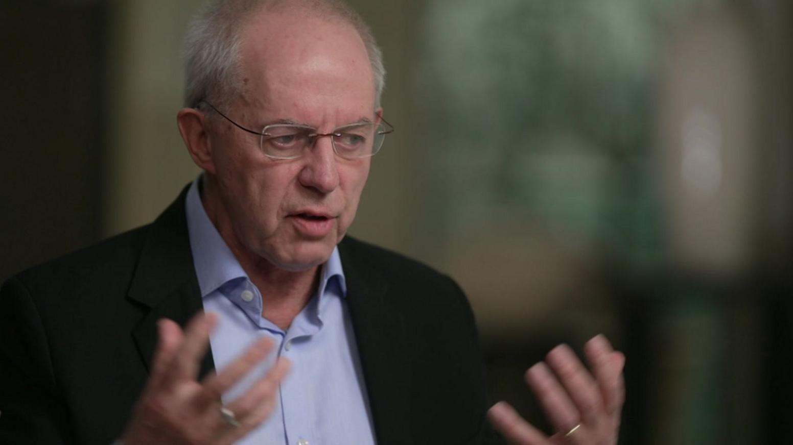Welby pictured gesturing with his hands 