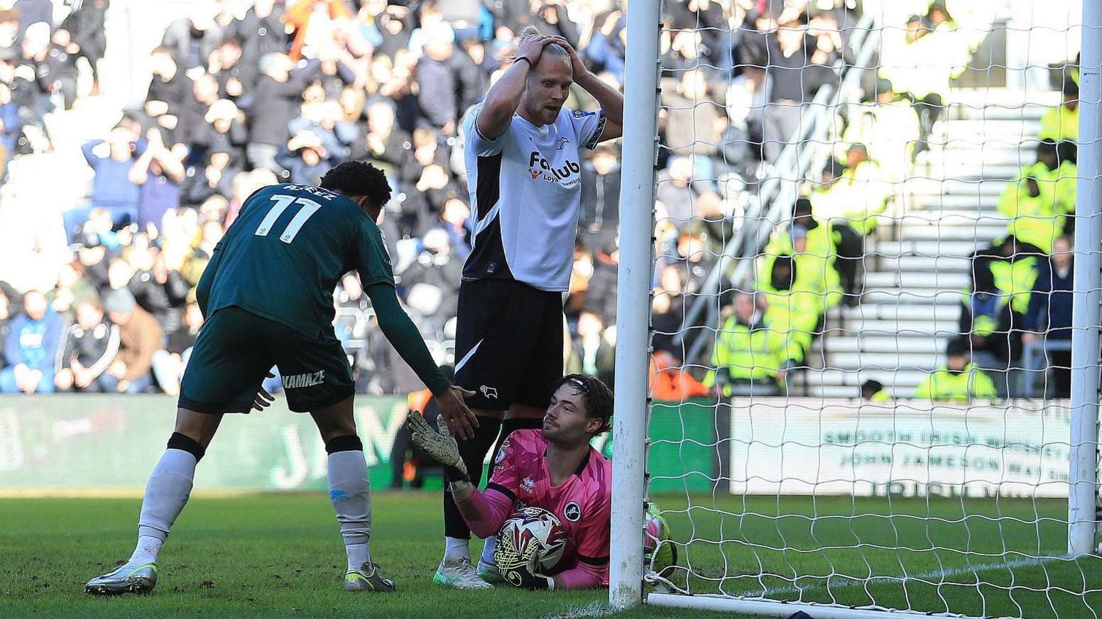 Lars-Jorgen Salvesen of Derby County shows dejection after being denied by Millwall goalkeeper Lukas Jensen