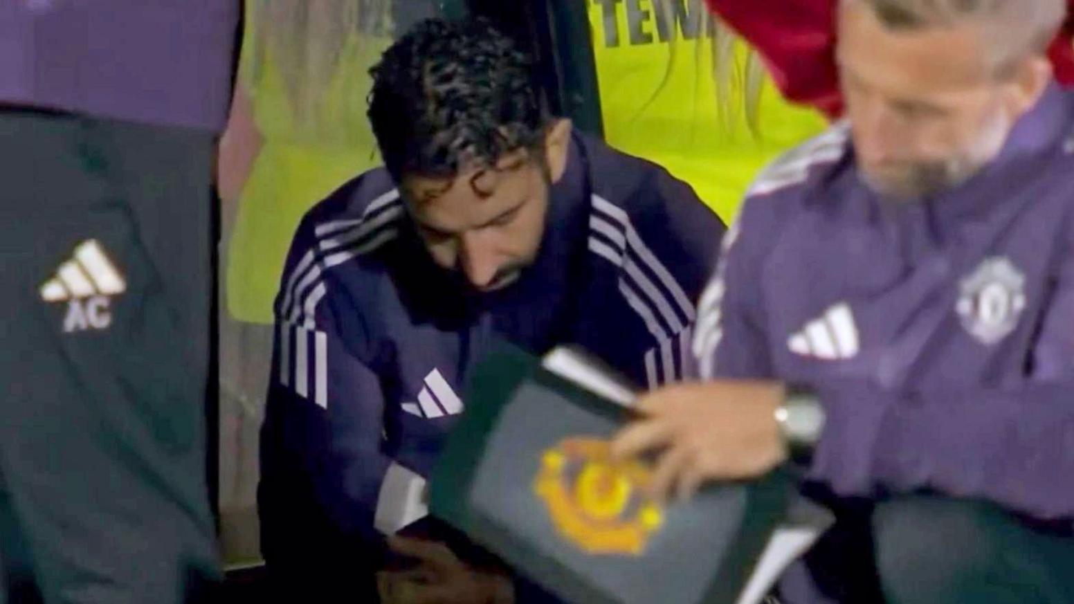 Ruben Amorim sat in the dugout looking down