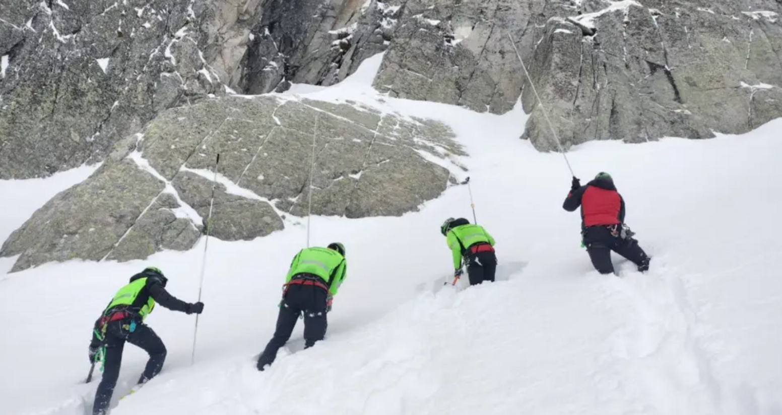 Rescue teams search the mountainous range for the two missing hikers.