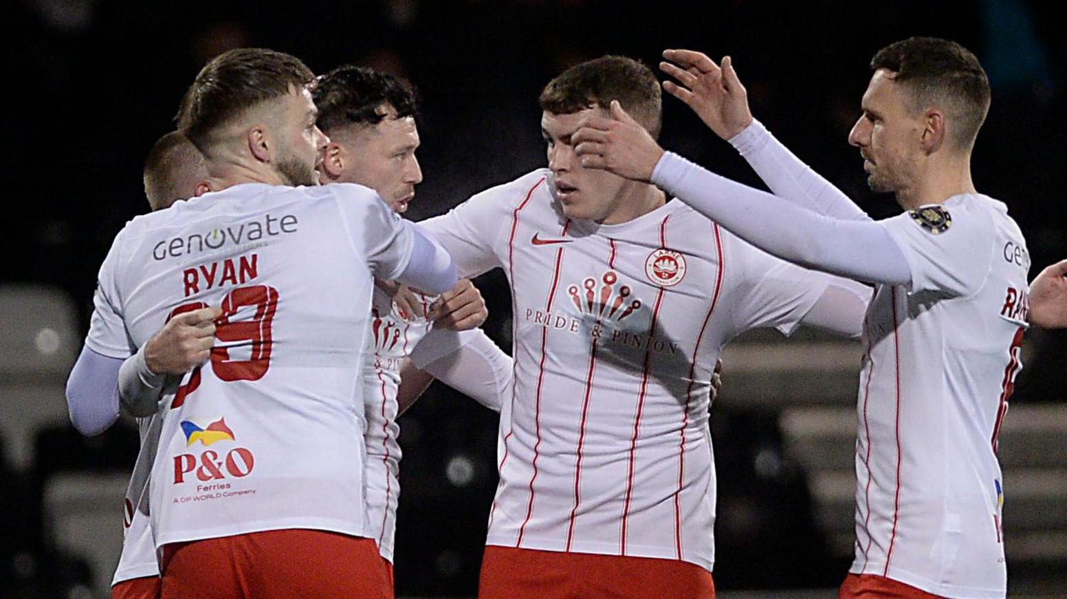 Larne celebrate after Levi Ives puts the champions back in front