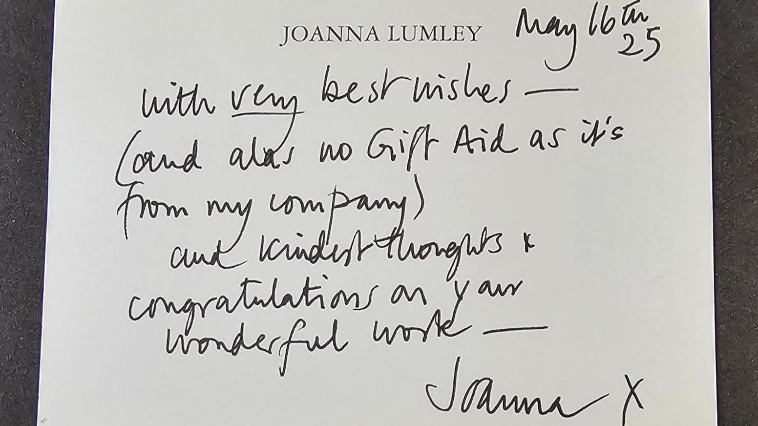 A notecard with Joanna Lumley typed at the top, the rest in black handwritten ink by Dame Joanna, expressing congratulations on their work.
