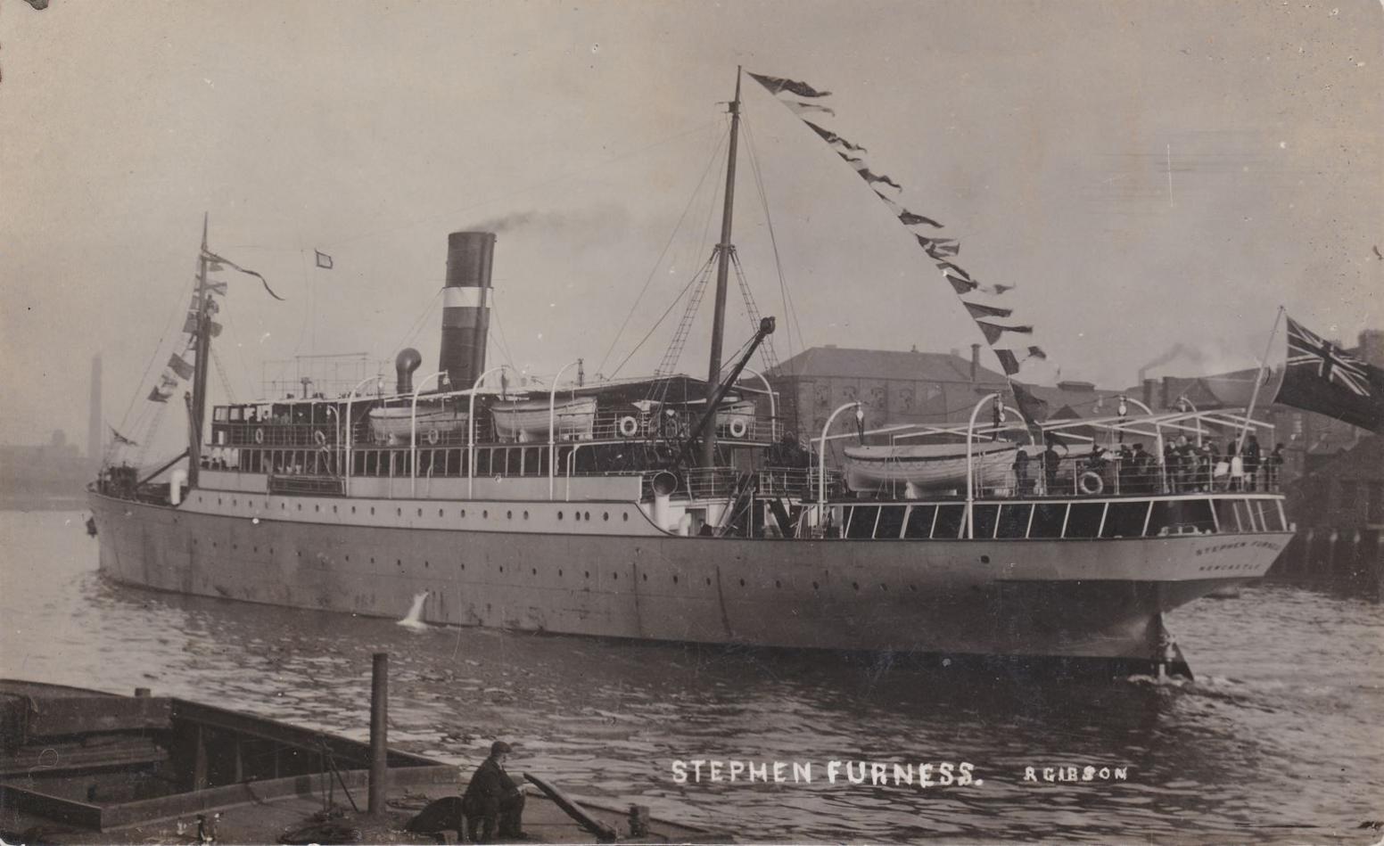 A sepia image of the boat HMS Stephen Furness, cruising along a body of water. Bunting strung across and a Union Jack flag waving from the front of the ship.