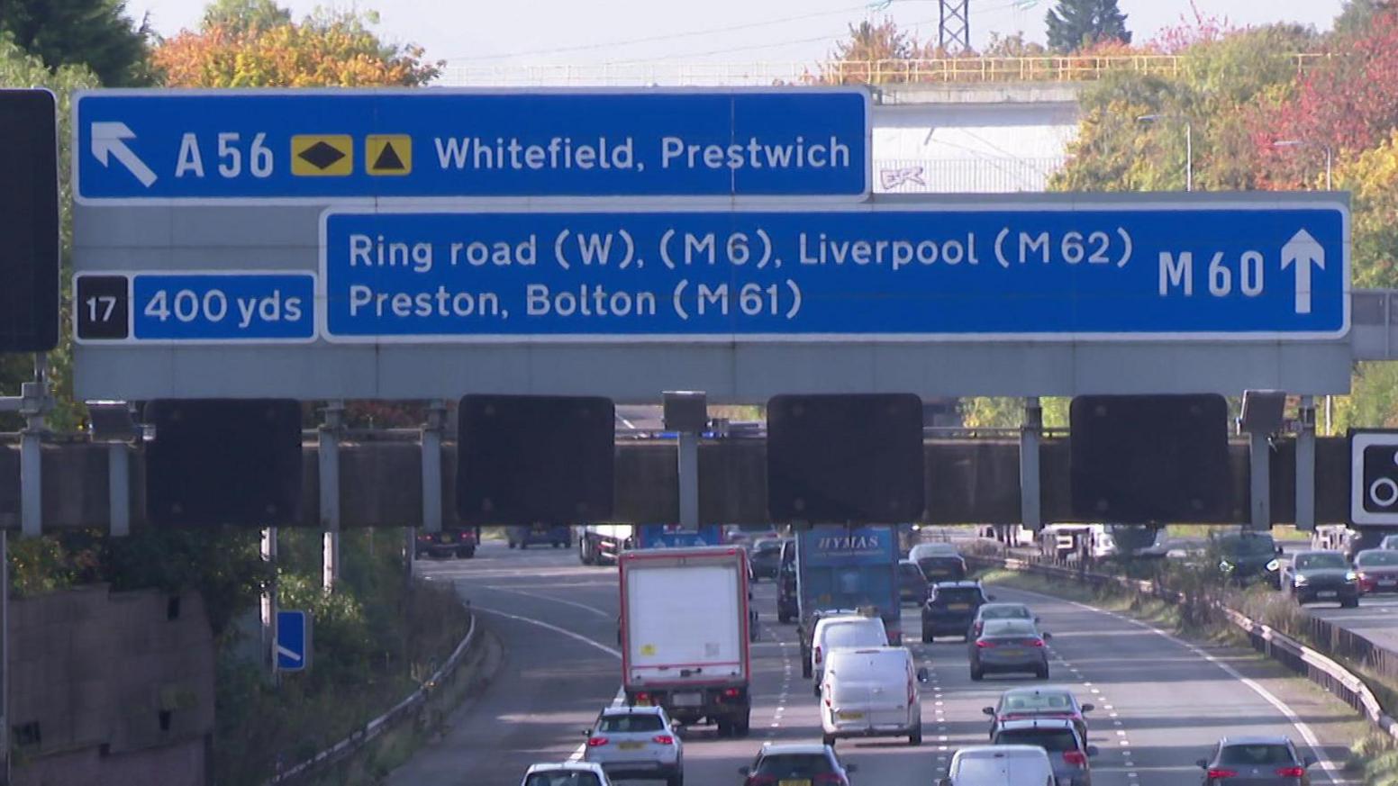 M60 motorway junction sign showing exit at junction 17 for A56 Whitefield, Prestwich