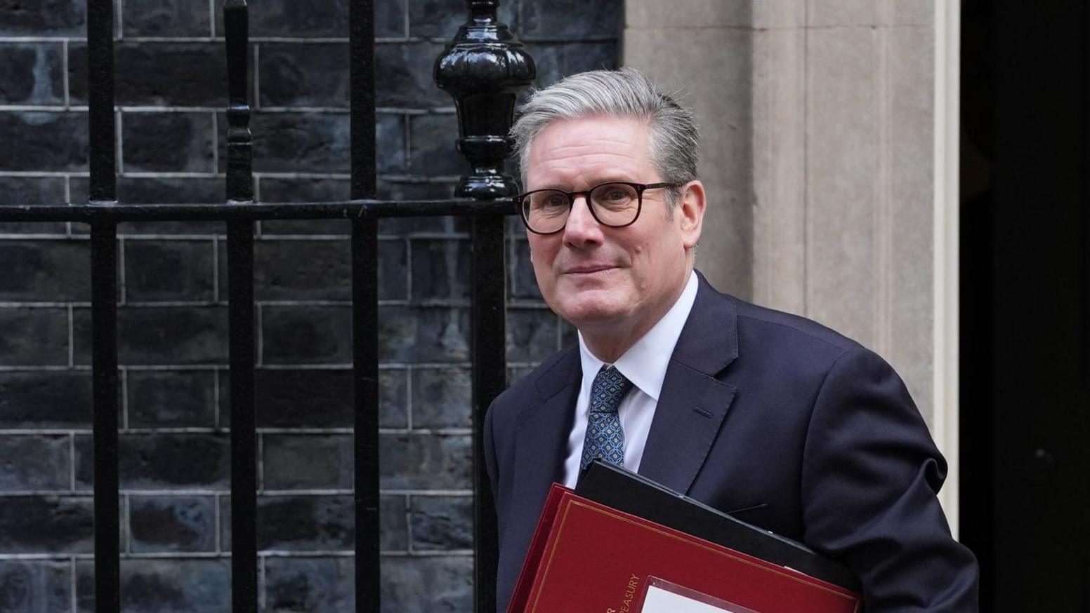 Prime Minister Keir Starmer carrying red box walking away from 10 Downing Street