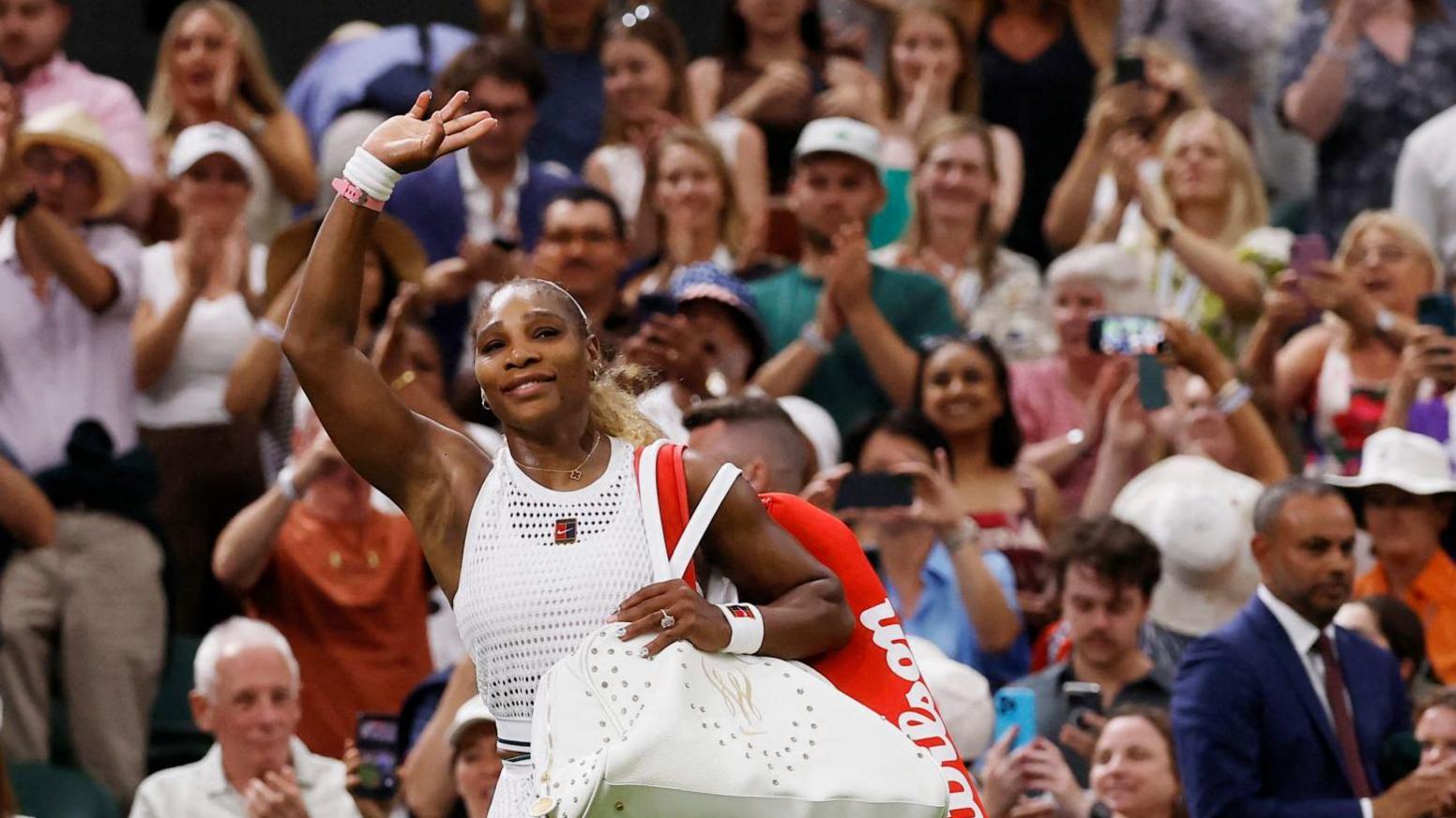 Serena Williams waves to the Wimbledon crowd