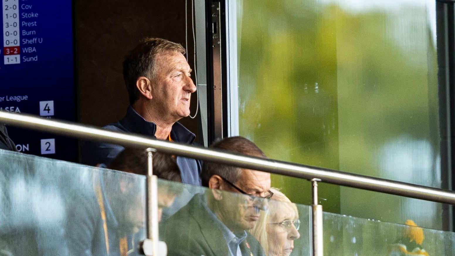 Huw Jenkins watches a Newport County match from a hospitality box at Rodney Parade