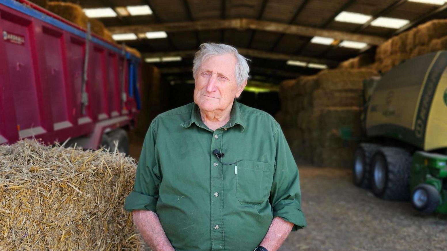 Roy Glover a third generation farmer and butcher stands on his farm outside Dartford.