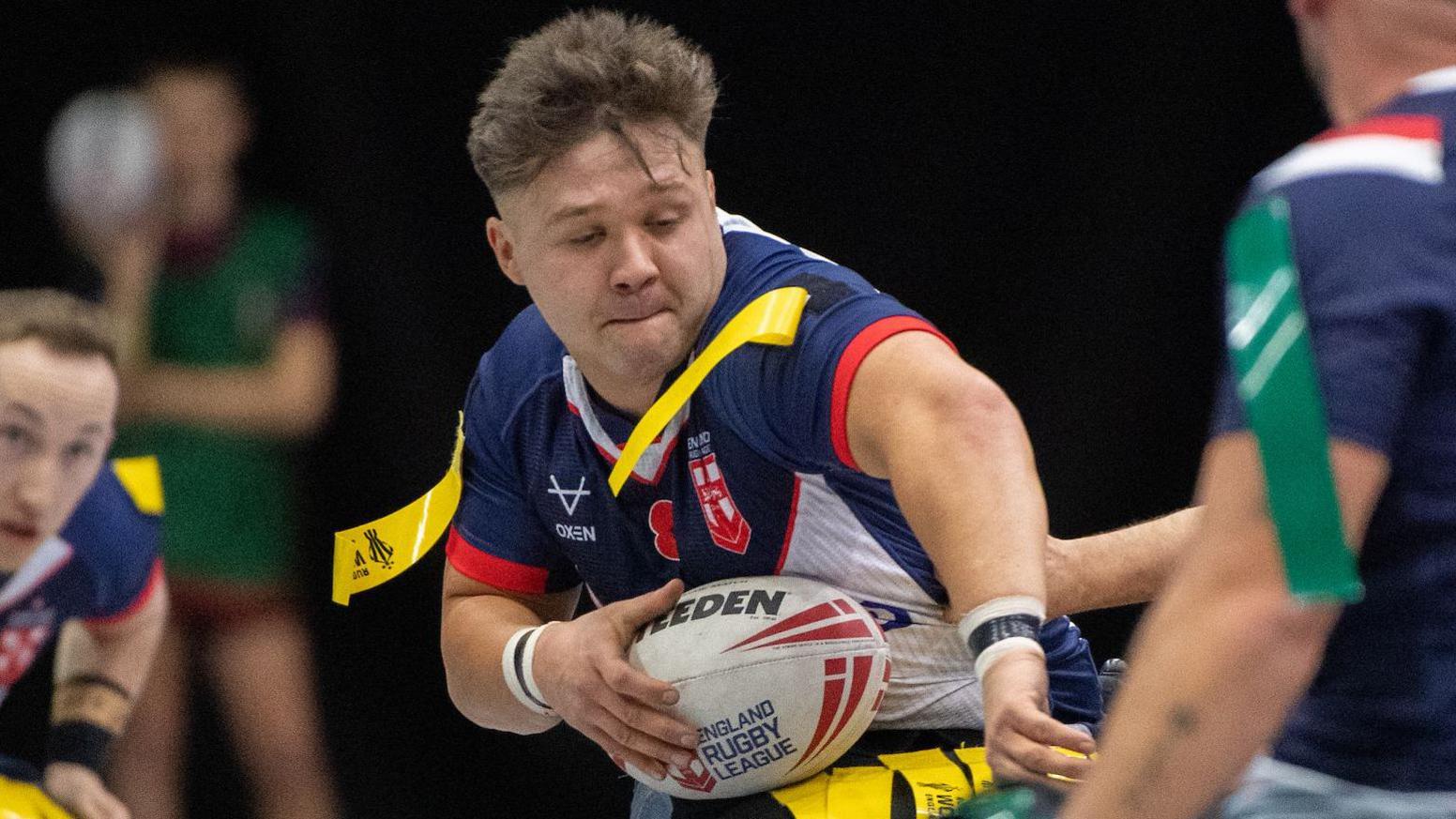 England wheelchair rugby league captain Tom Halliwell in action