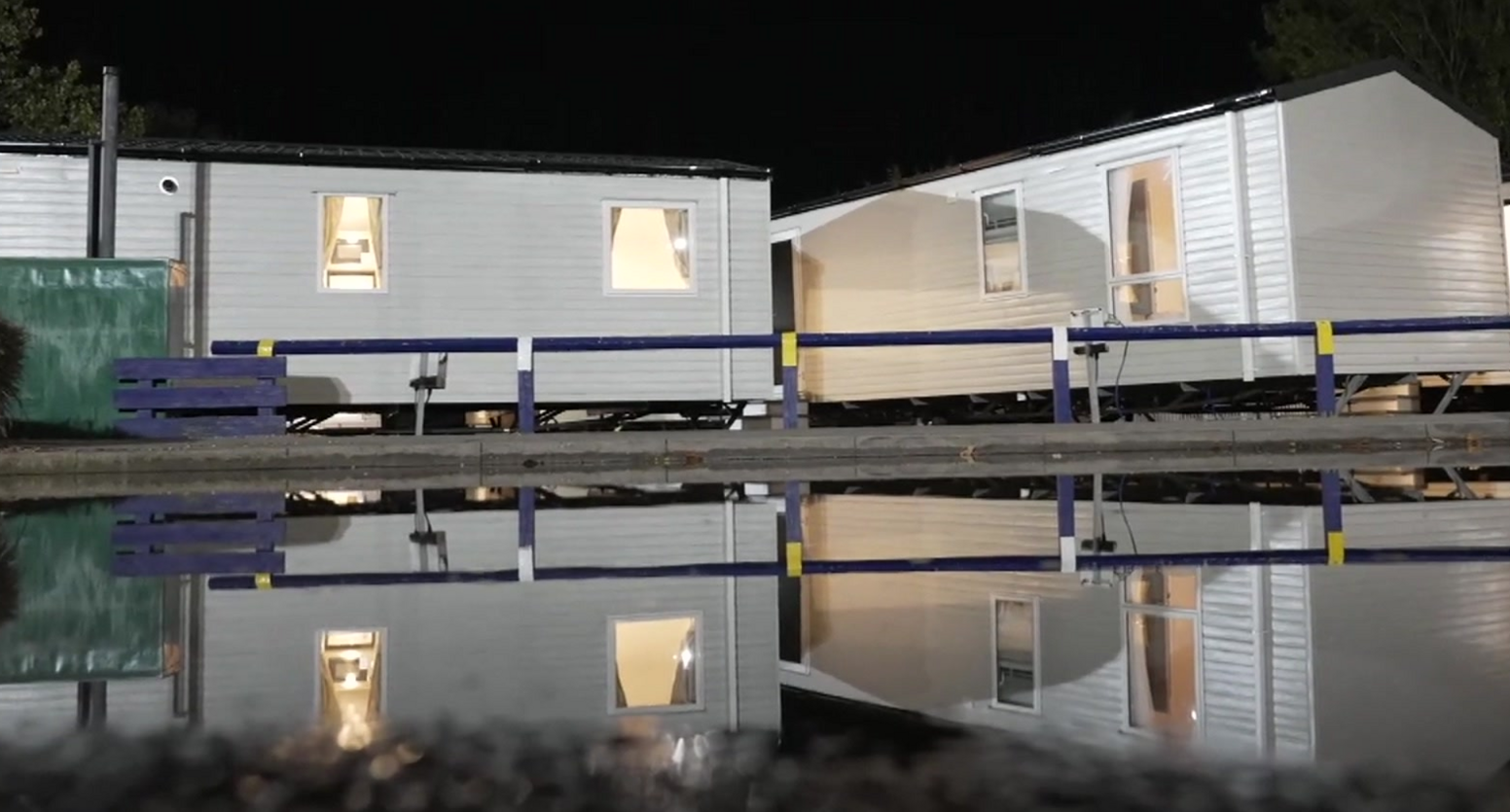 Reflective shot of water beneath caravans at Billing Aquadrome