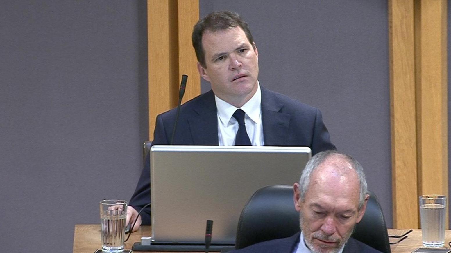 Lee Waters sat looking at the first minister in the Senedd on Tuesday