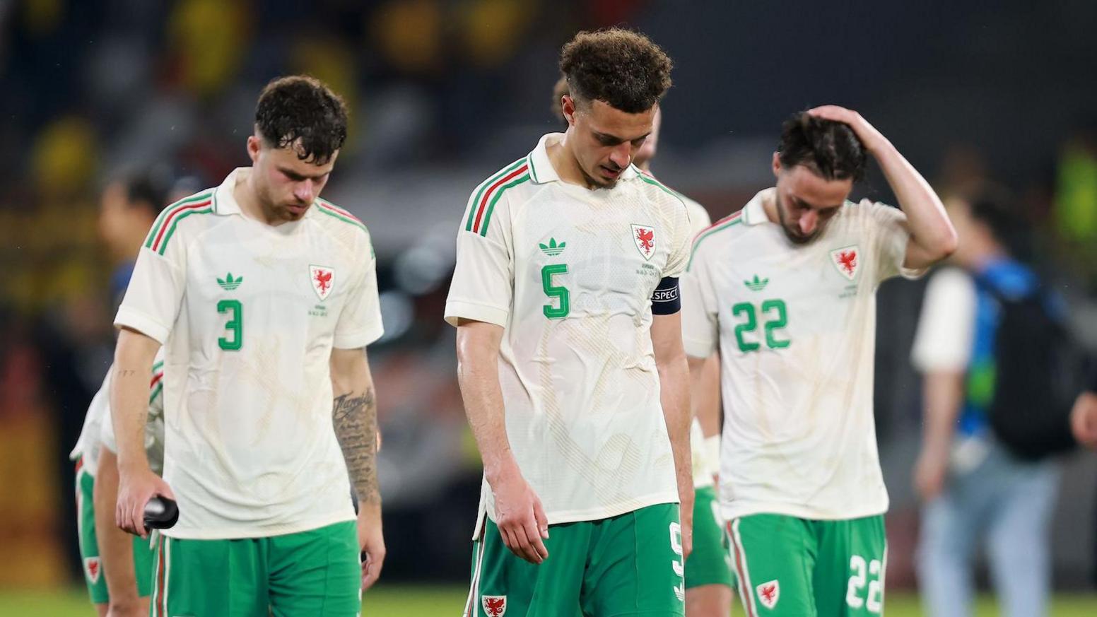Neco Williams, Ethan Ampadu and Josh Sheehan after Wales' defeat by Romania