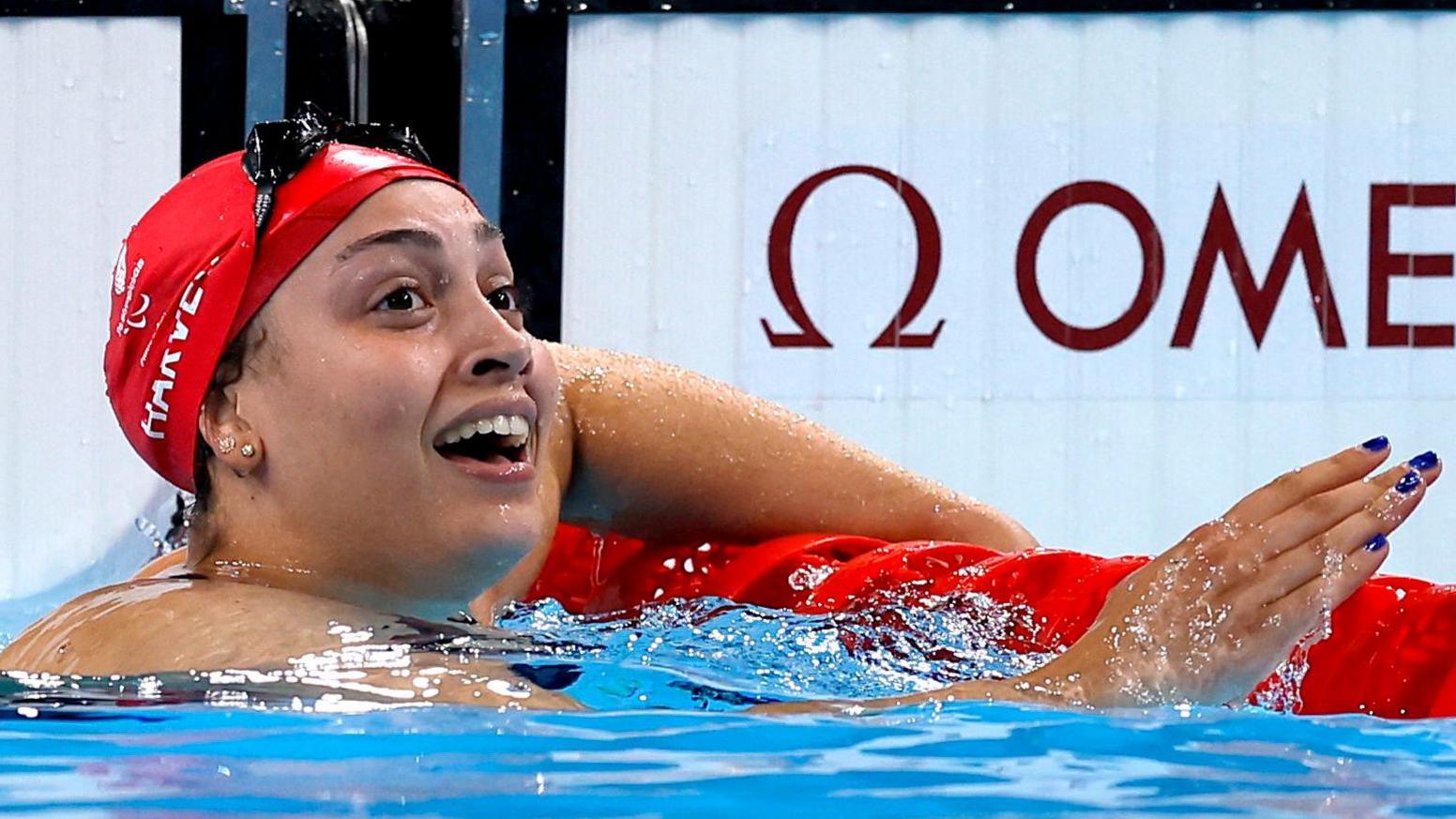 Grace Harvey looks up after winning her Paralympic gold medal