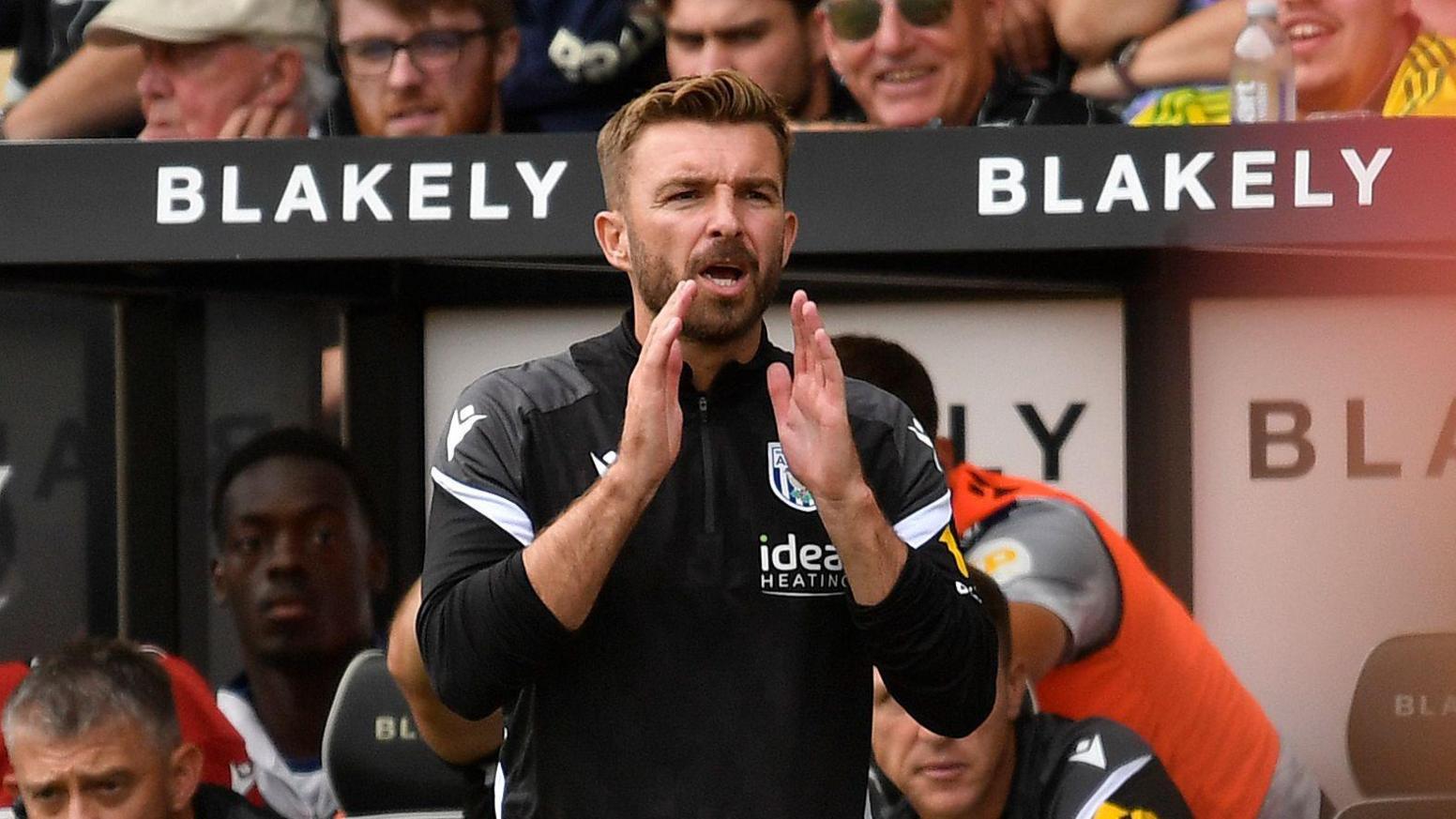 West Bromwich Albion boss James Morrison applauds his team during Saturday's win at Norwich