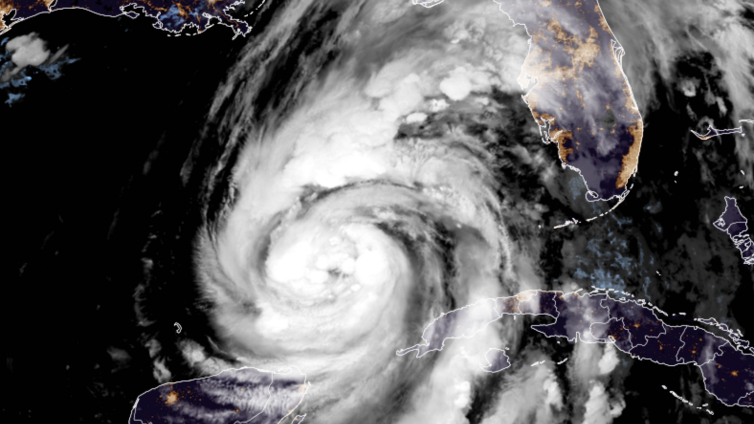 Satellite image showing a huge swirl of cloud in the Gulf of Mexico with the coast of the US outlined