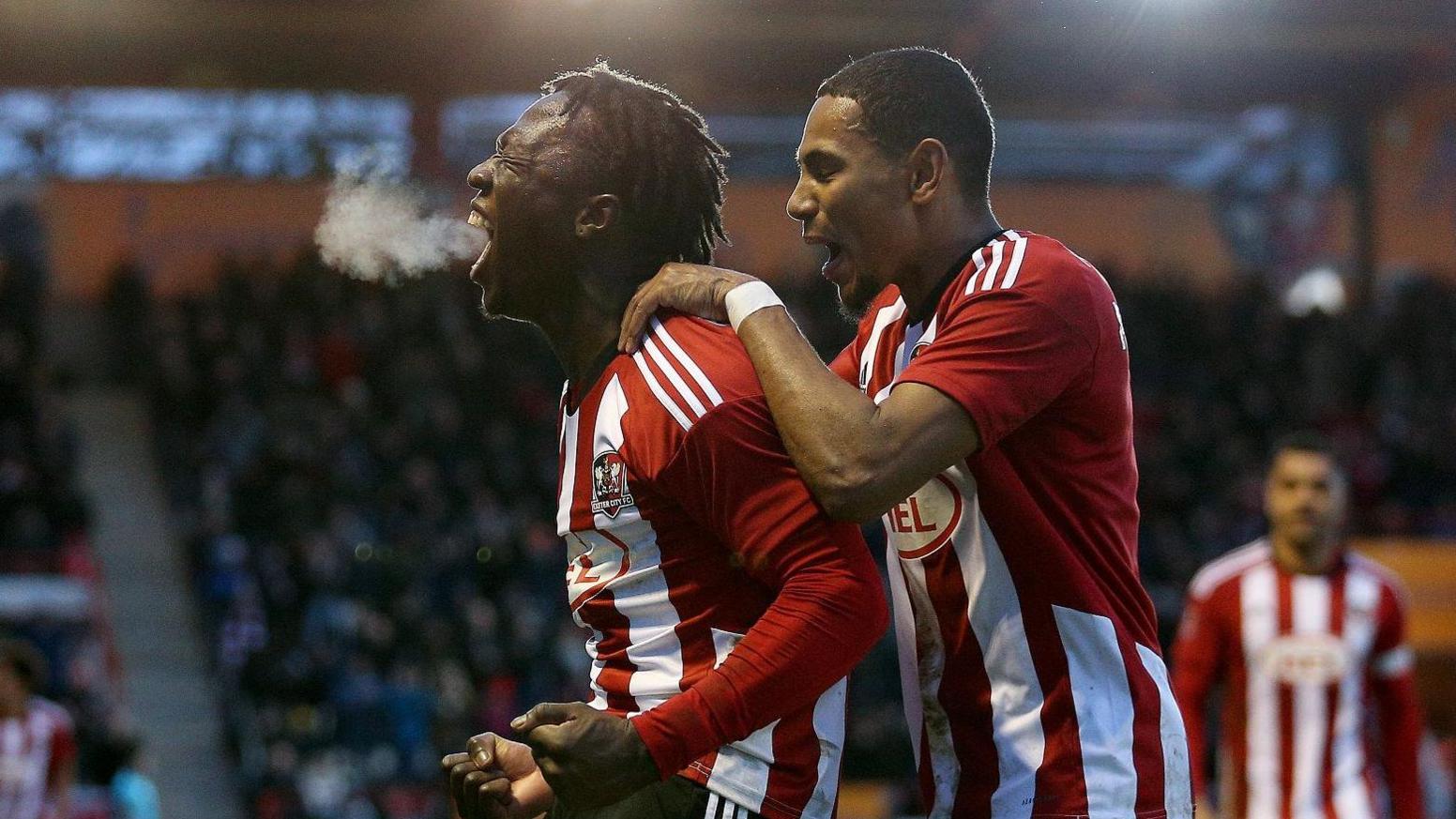 Vincent Harper celebrates after putting Exeter City 3-1 up against Oxford United