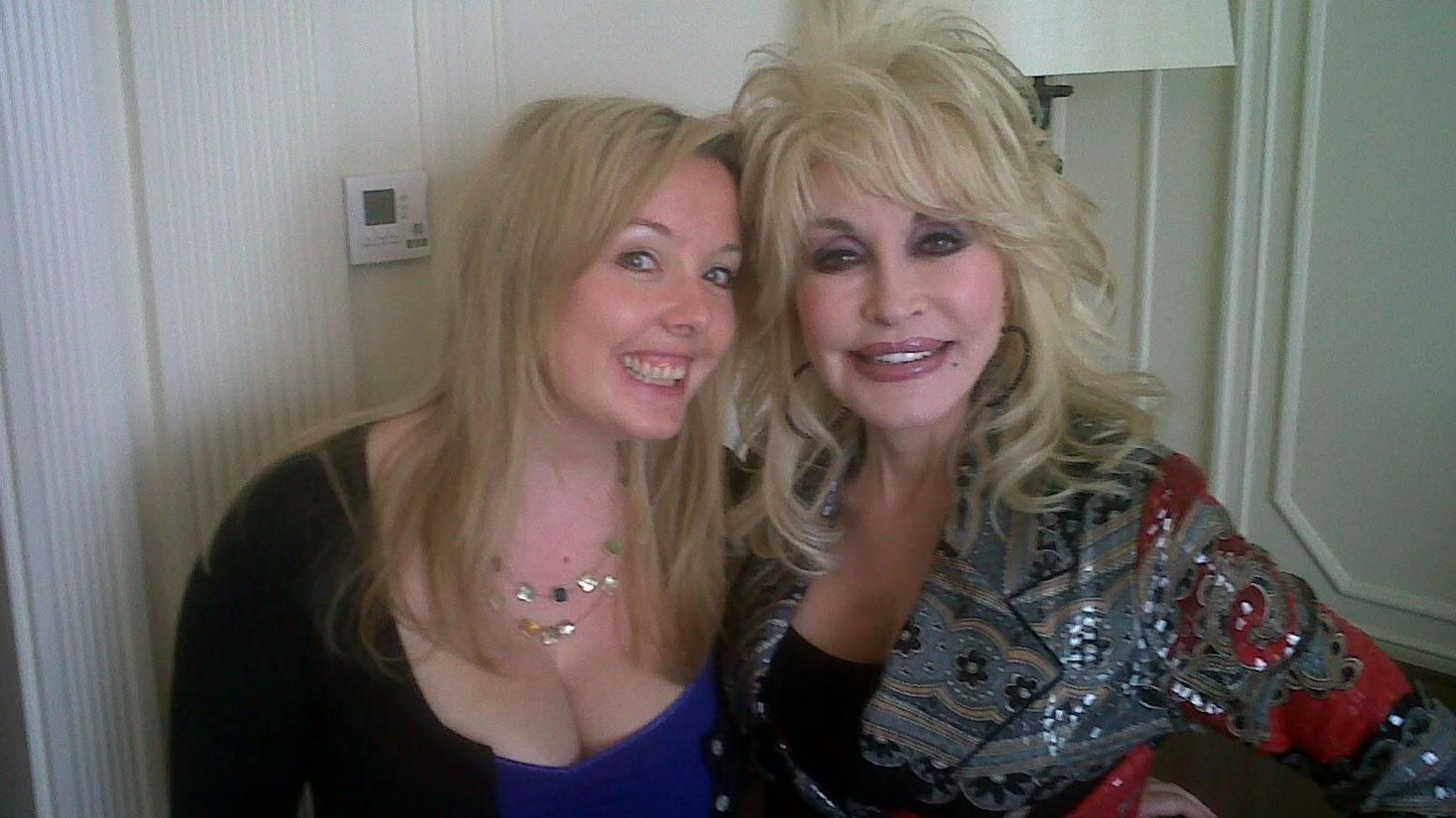 Smiling blonde Jade Wright, former music editor of the Liverpool Echo, smiles next to Dolly Parton, wearing a sequinned grey jacket