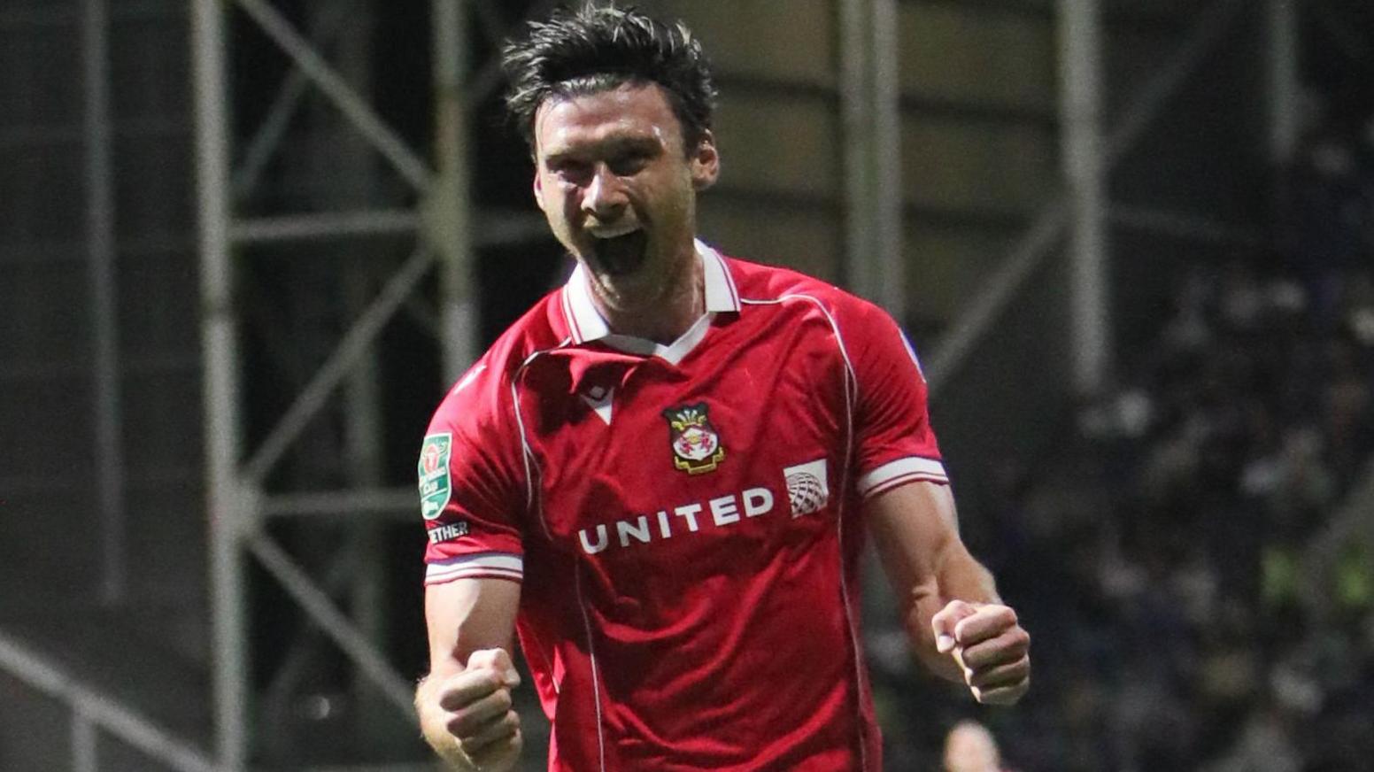 Kieffer Moore celebrating scoring for Wrexham