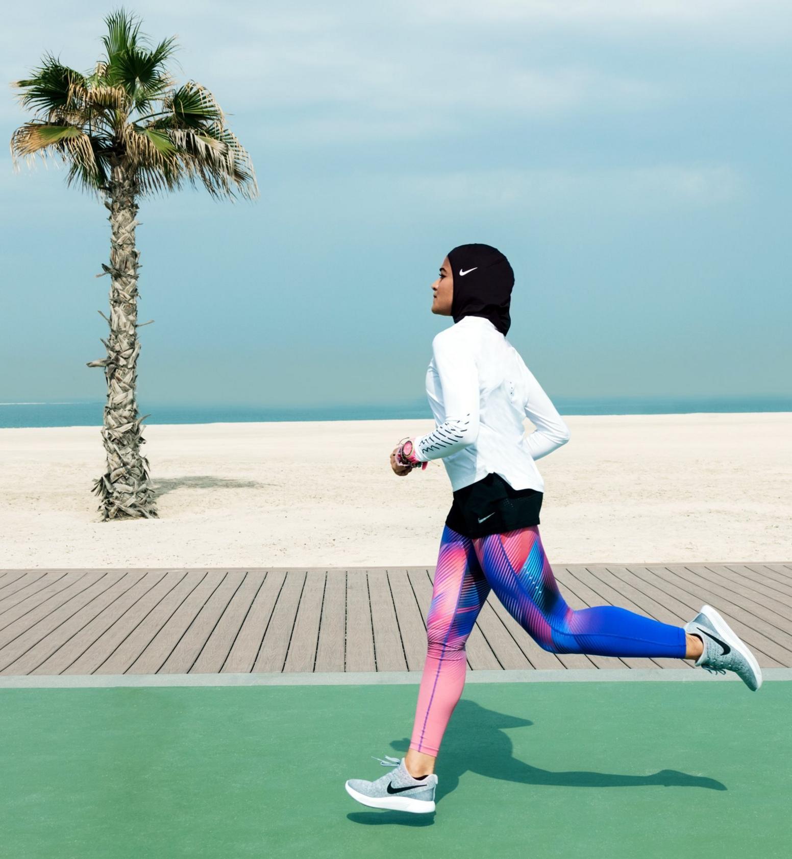 Manal Rostom jogs wearing Nike"s new hijab for Muslim female athletes.