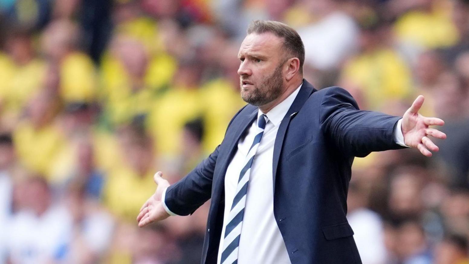 Bolton Wanderers boss Ian Evatt stands forlorn on the touchline