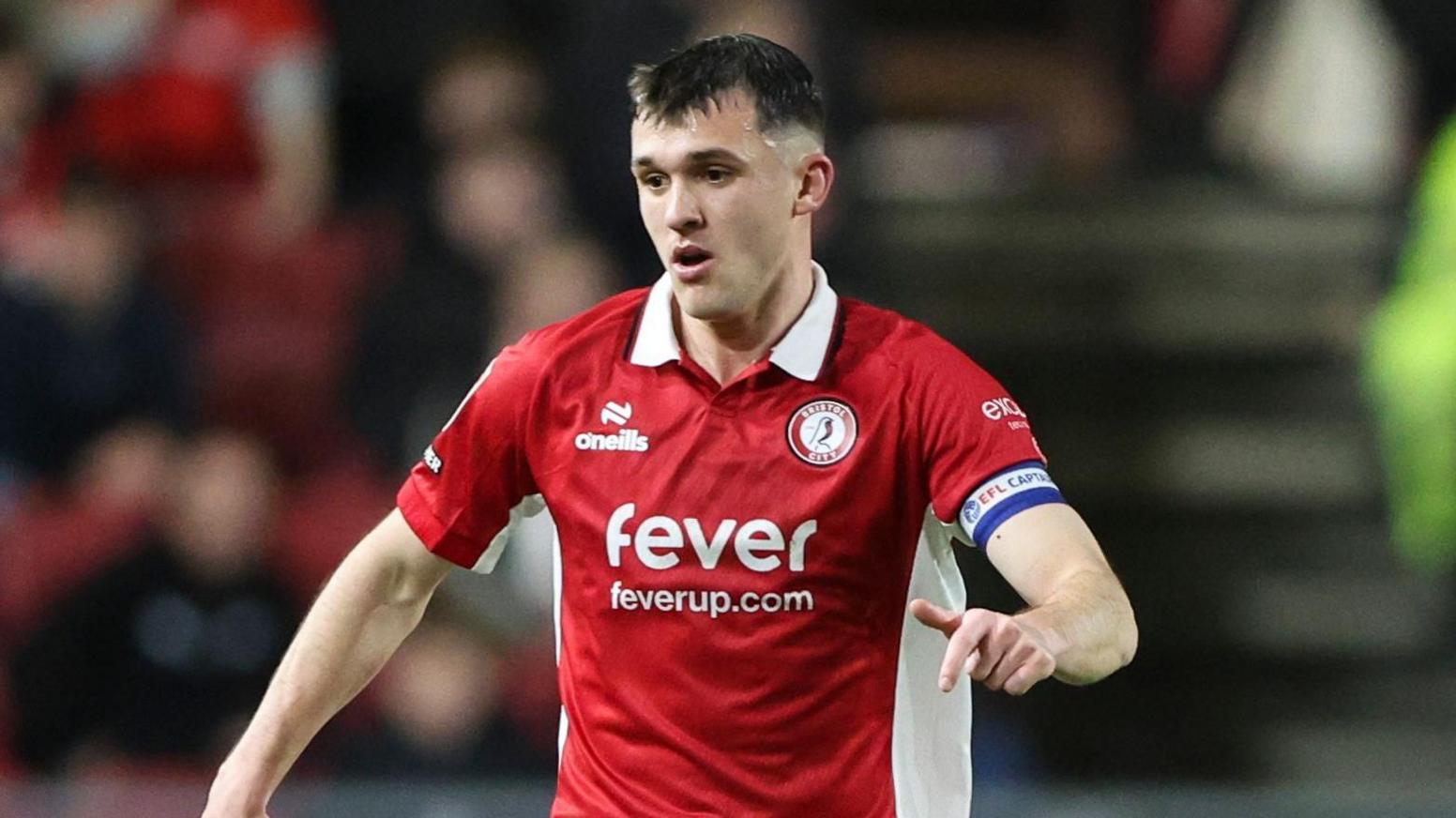 Jason Knight runs with the ball at his feet during a match for Bristol City at Ashton Gate
