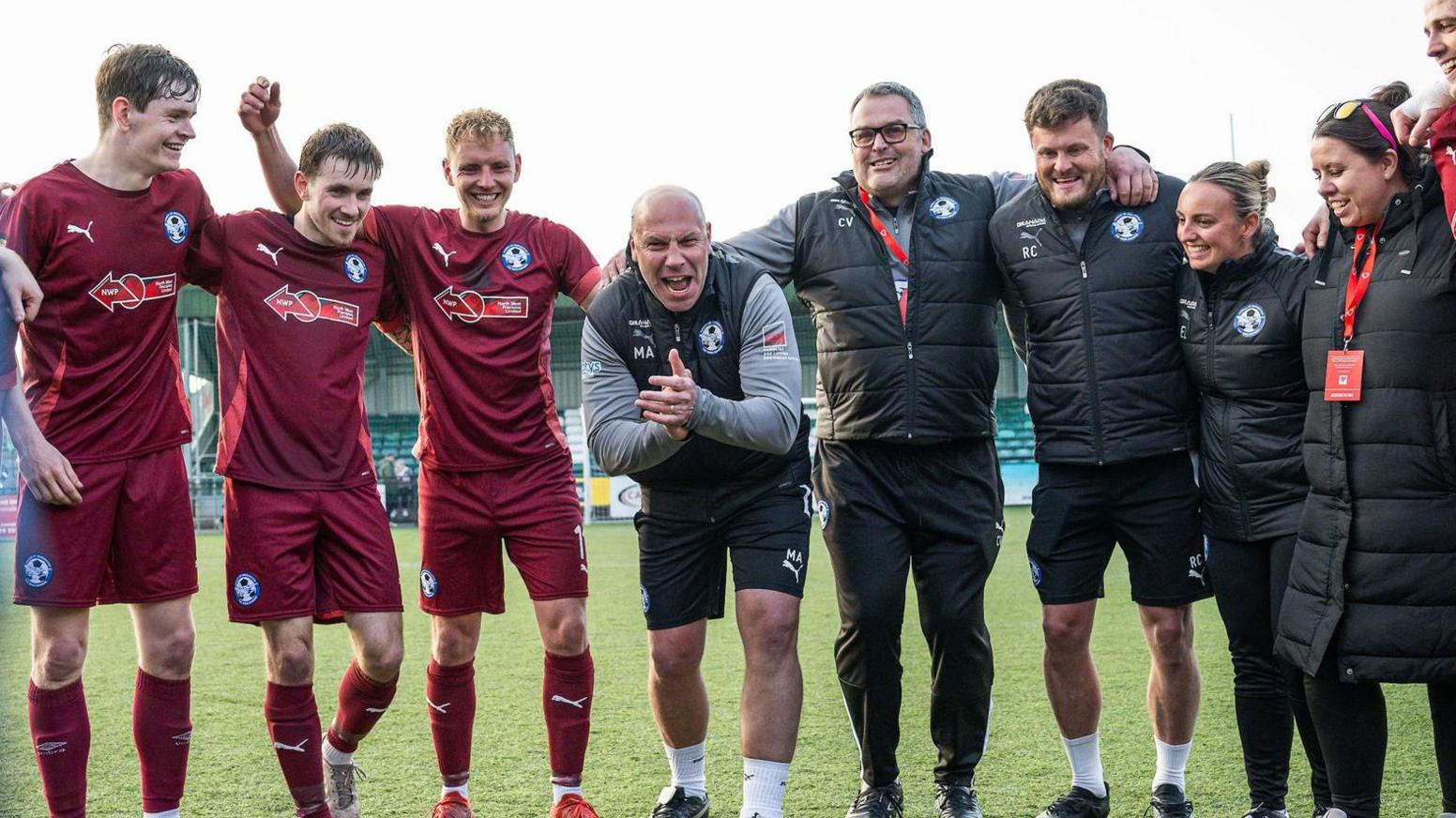 Mark Allen (centre) celebrates with Airbus players and staff