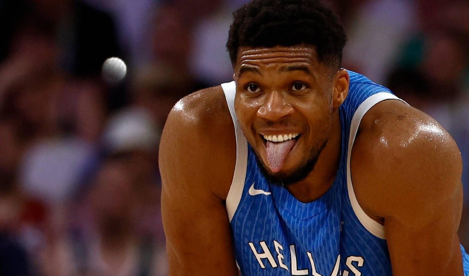 Giannis Antetokounmpo pokes out his tongue while he plays for Greece against Spain the Paris 2024 Olympics