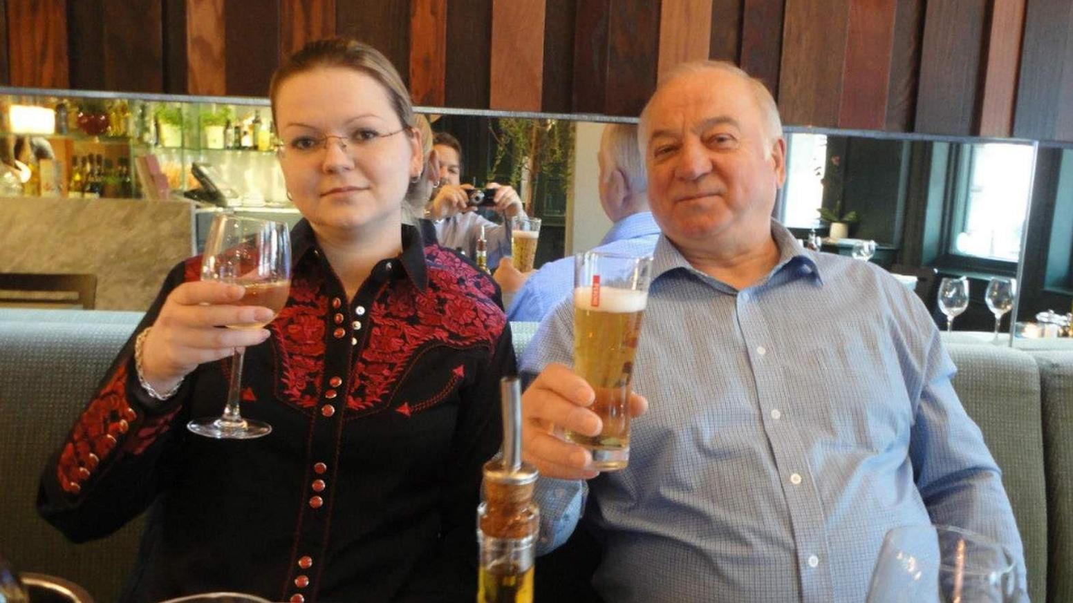 Sergei Skripal and his daughter Yulia are pictured eating dinner together and raising their glasses for the camera.