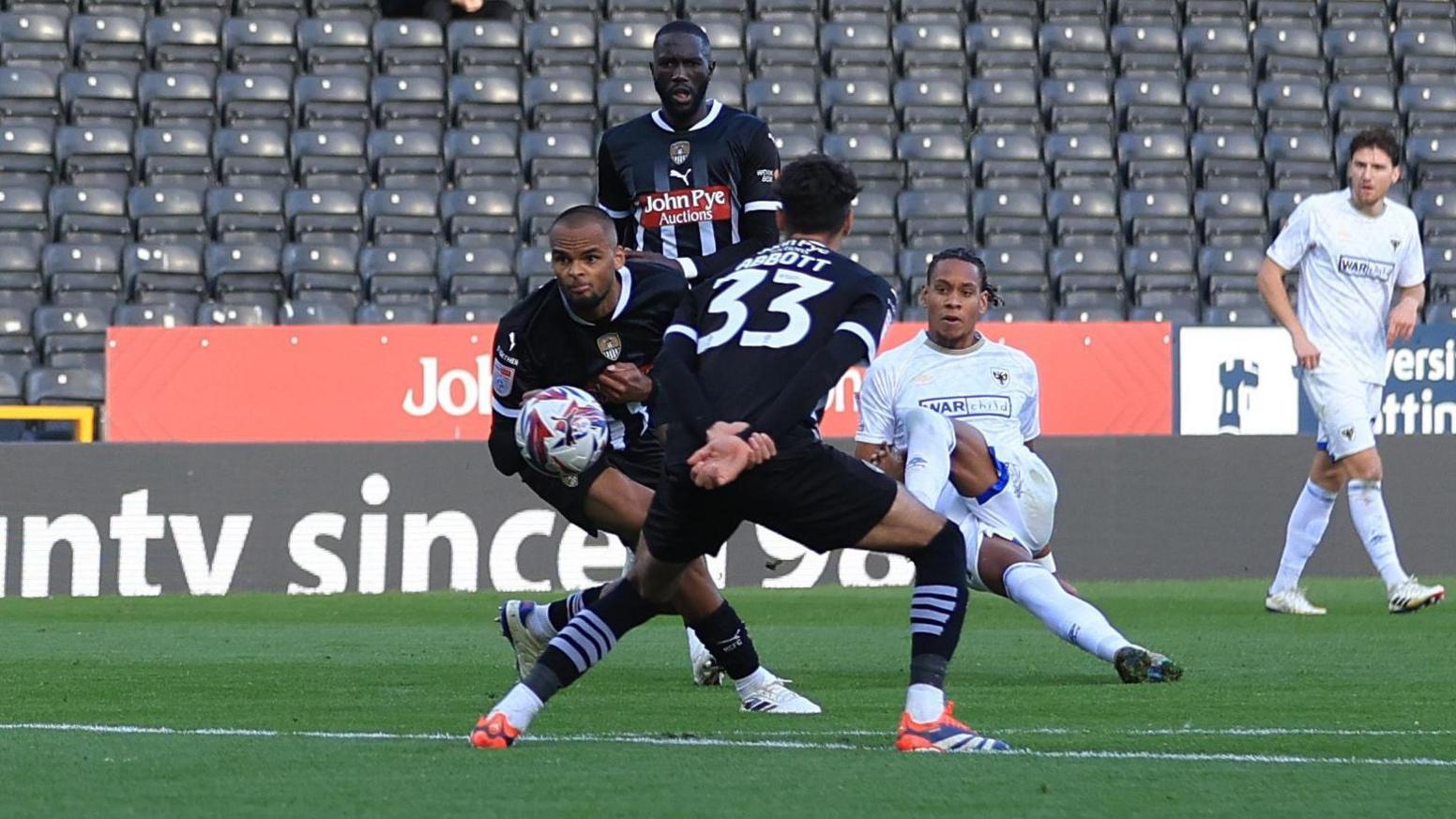 Action between Notts County and AFC Wimbledon at Meadow Lane in October 