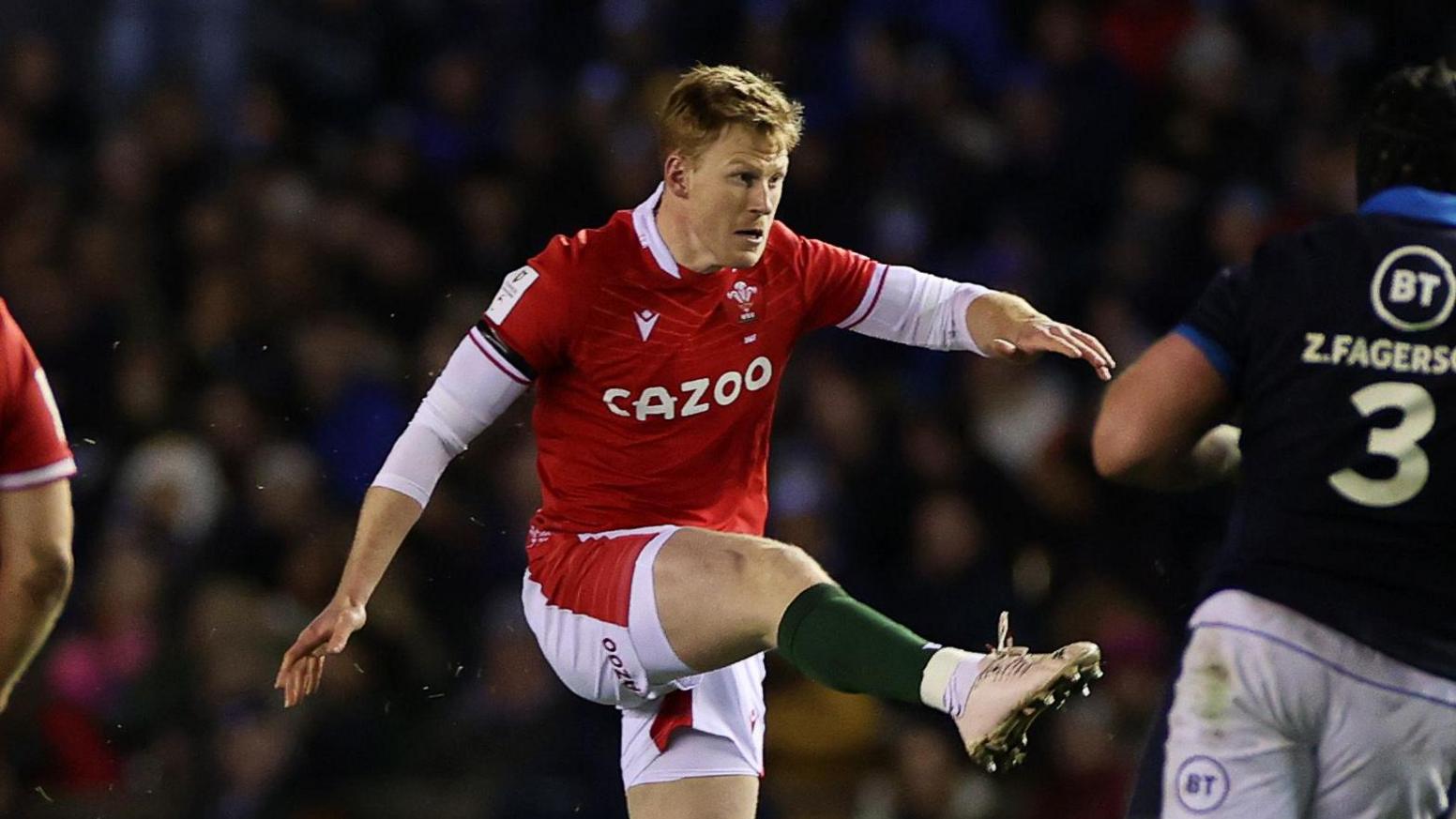Rhys Patchell kicks the ball in Wales' 2023 game against Scotland