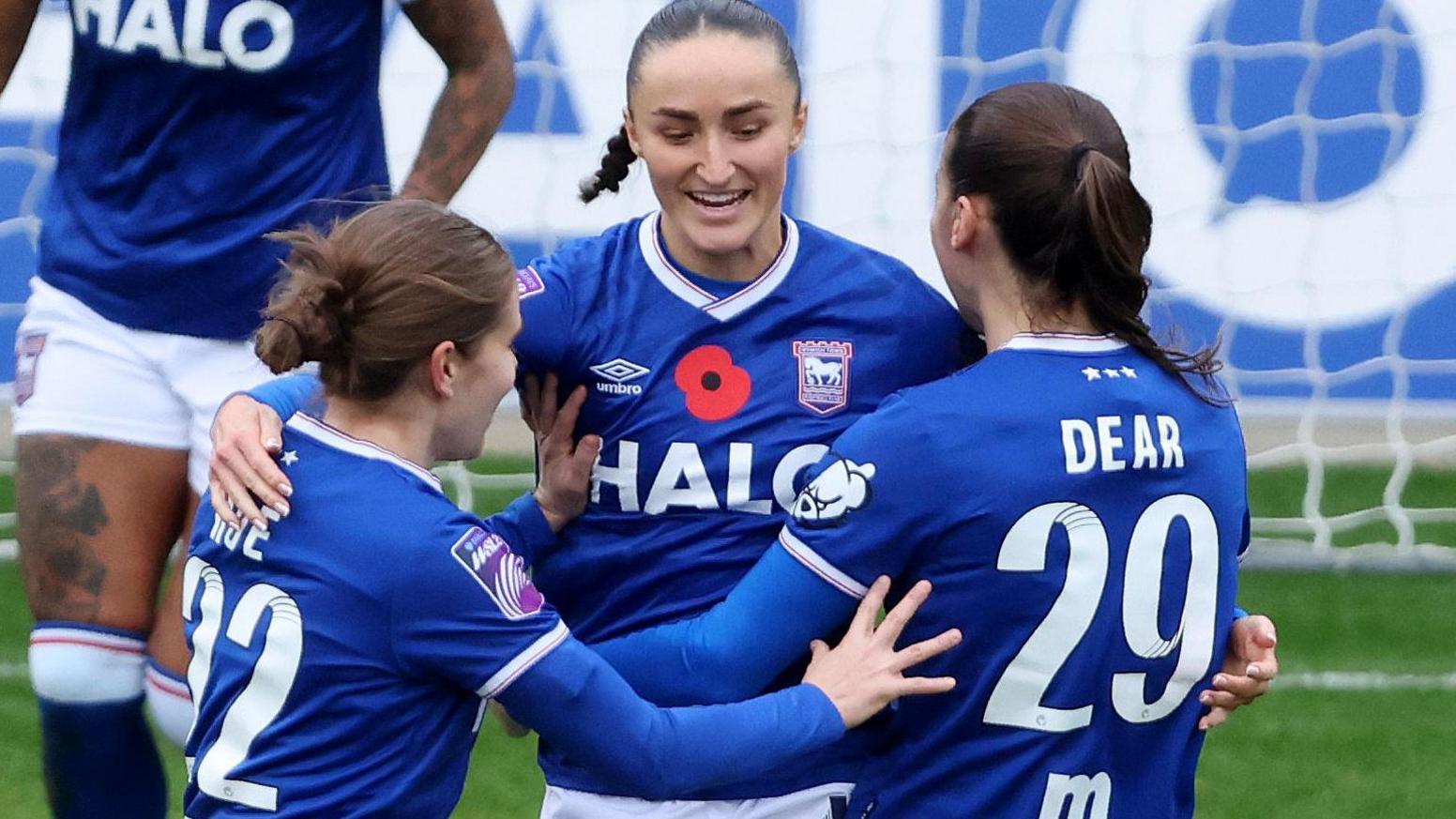 Sophie Peskett is embraced by team-mates after scoring against Crystal Palace