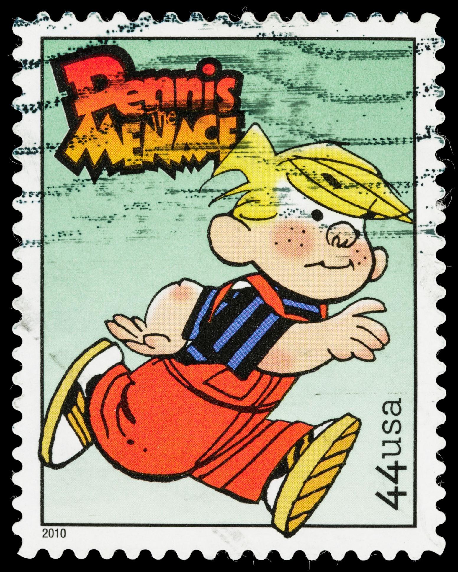 a postage stamp with the American Dennis the menace who is blonde and wears a black and blue striped t-shirt and red dungarees