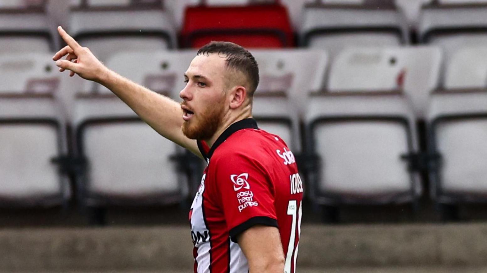 Ben House celebrating scoring his second goal for Lincoln against Luton 