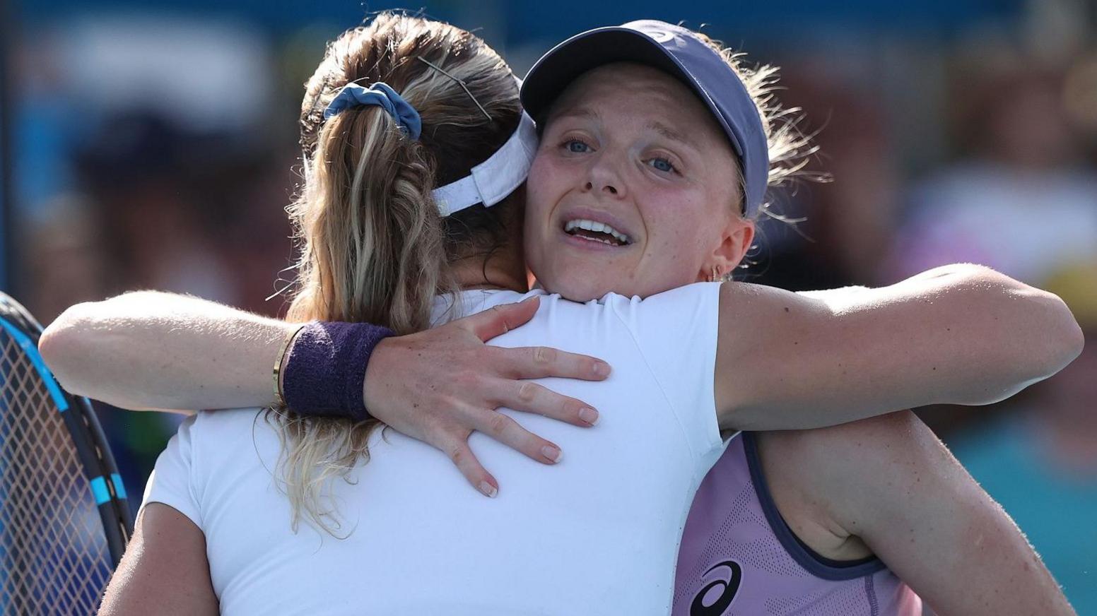 Harriet Dart embraces Jana Fett at the net after winning her Australian Open first round match