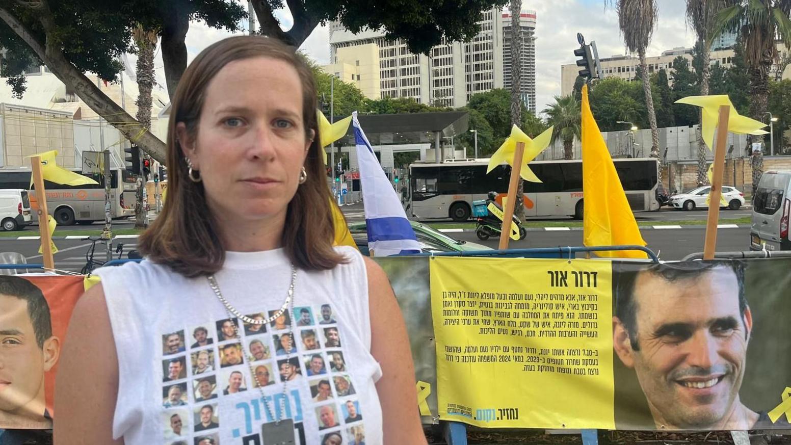 Inbar Goldstein wearing a shirt with pictures of hostages,