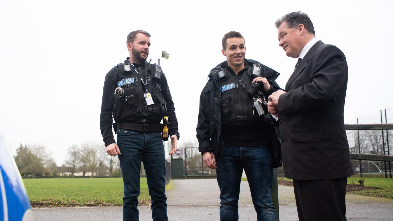 David Lloyd with two police officers