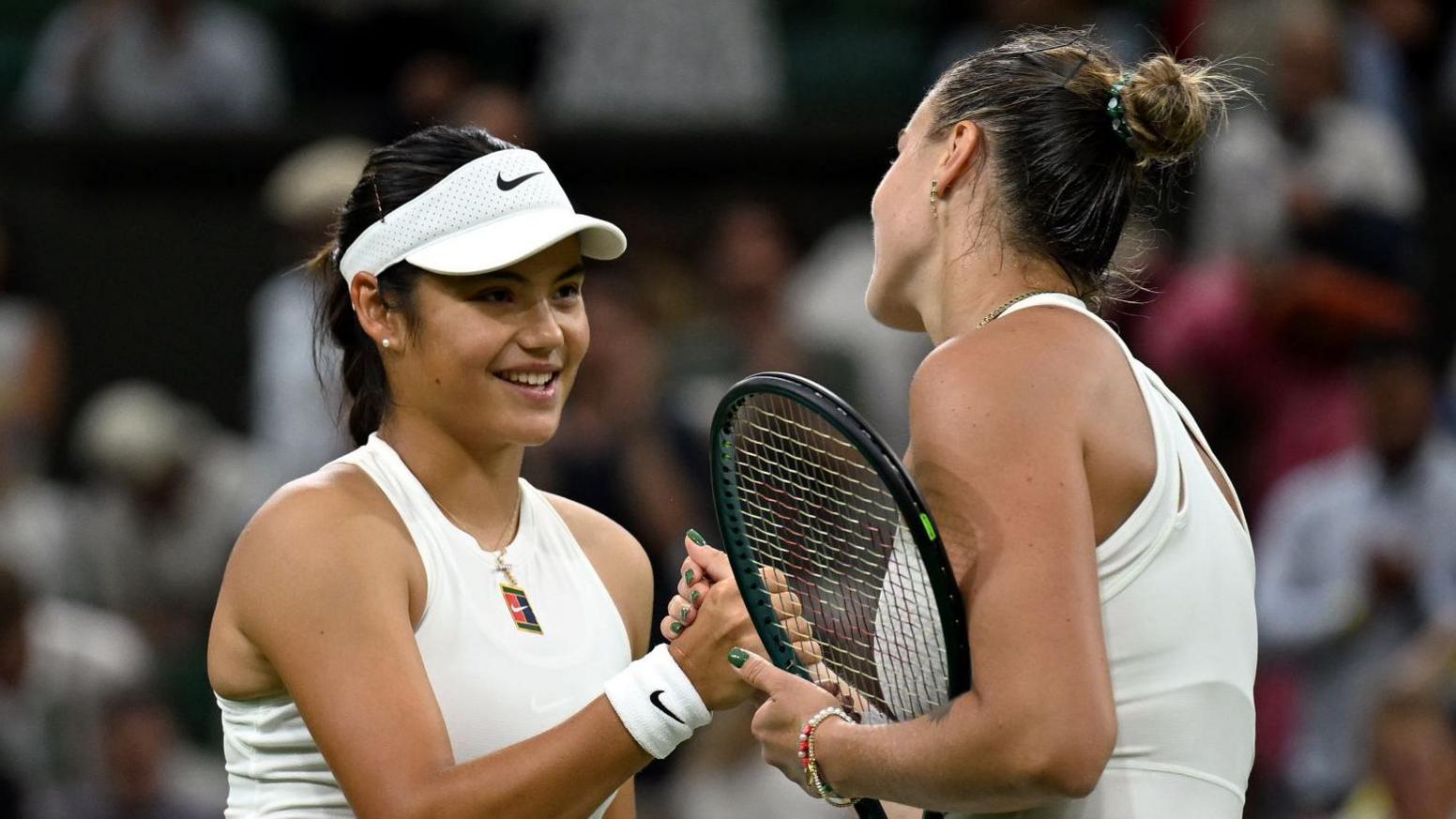 Emma Raducanu and Aryna Sabalenka shake hands after their Wimbledon match