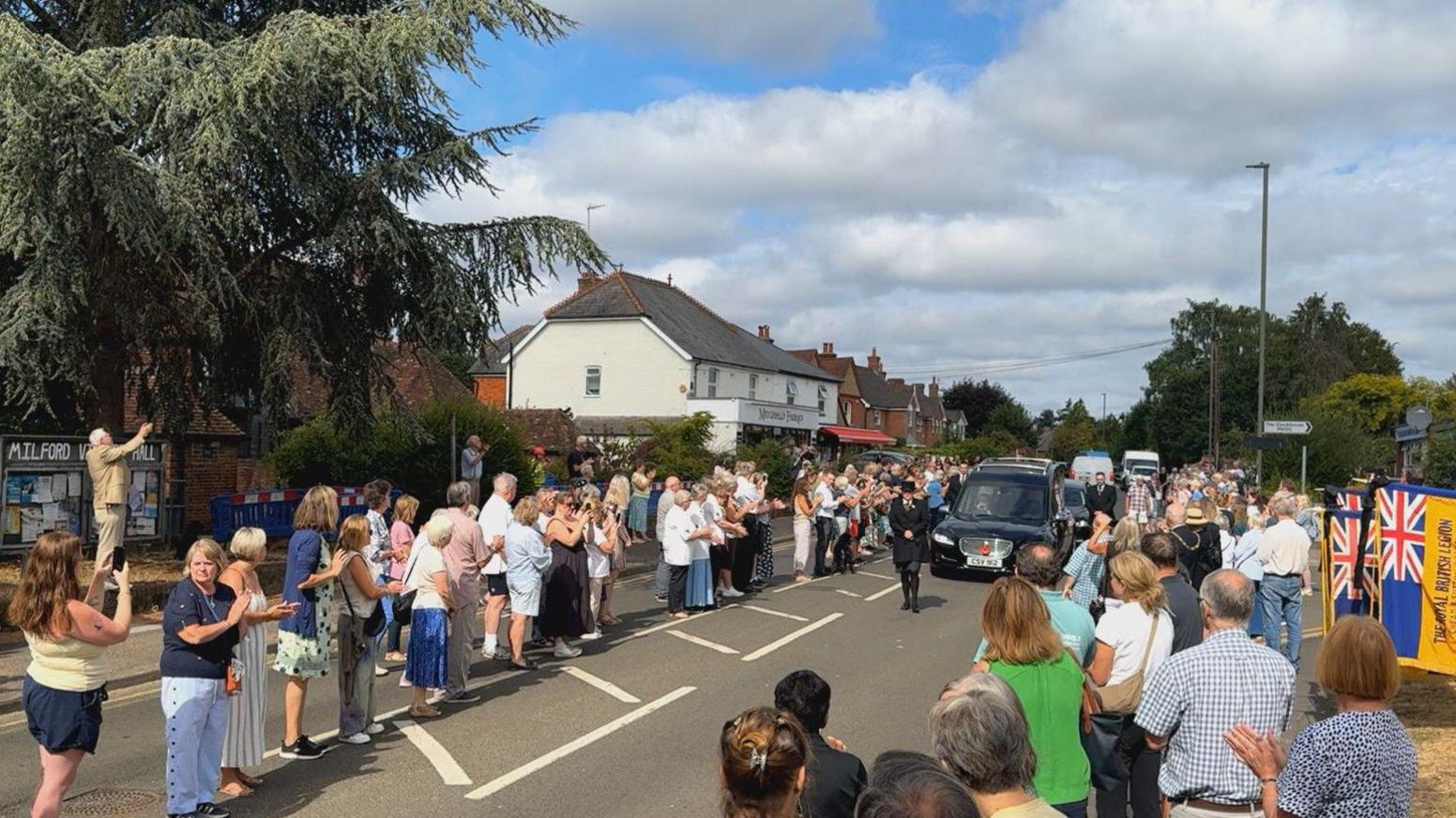Crowds of people on a street. 