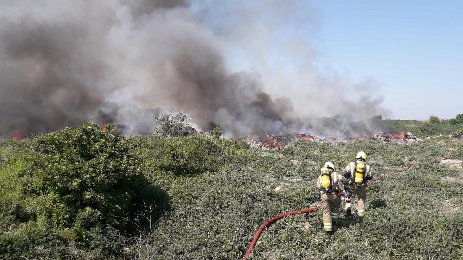 Firefighters tackle a fire at Arnolds Field in 2020