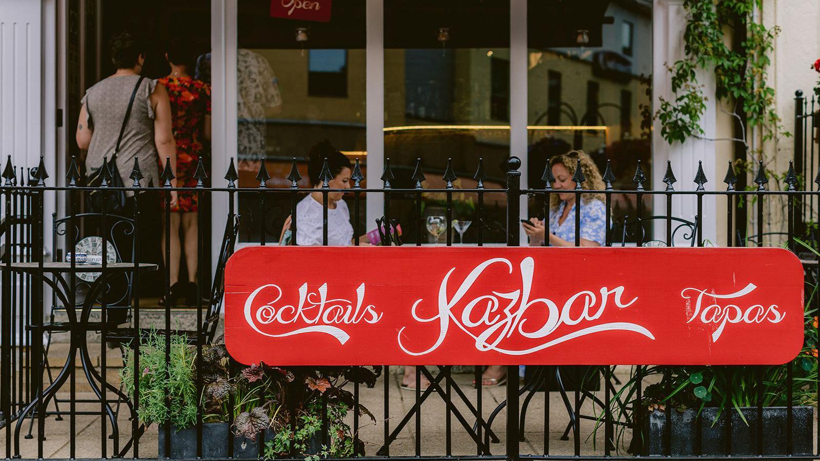 Women sit outside of tapas and cocktail bar in Yeovil